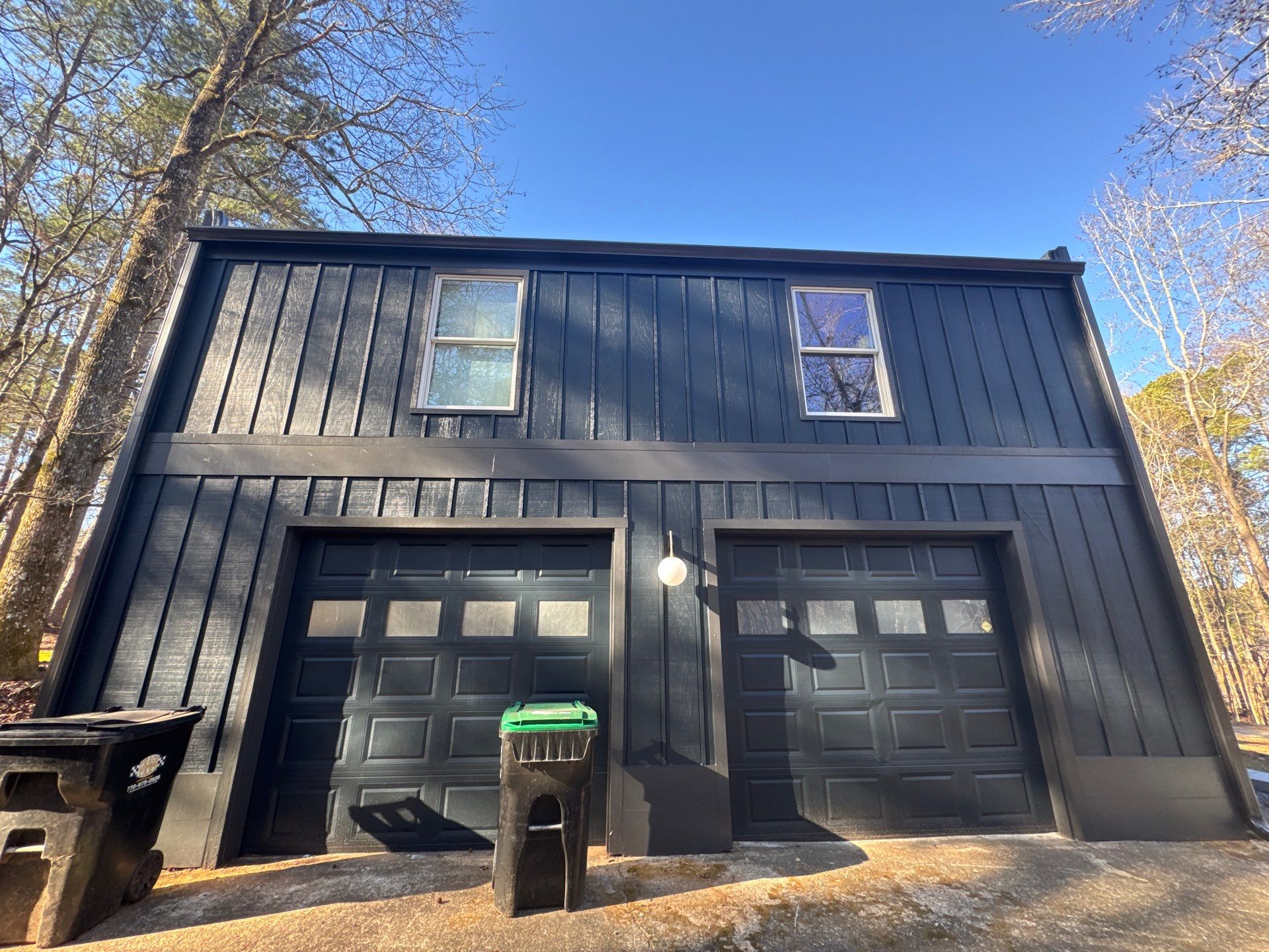 Full Exterior Transformation With Modern Black Finish by Swift Home Renovations