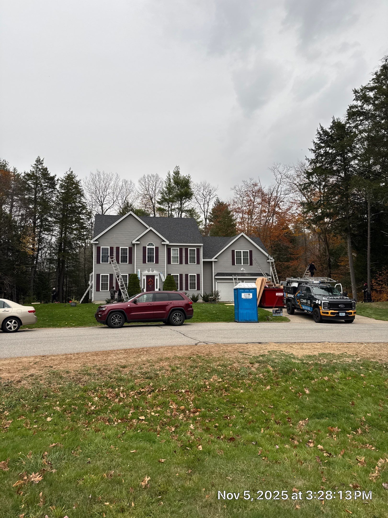 Brentwood, NH Roof Replacement with Velux Skylights and Onyx Black Owens Corning Shingles by Compass exteriors