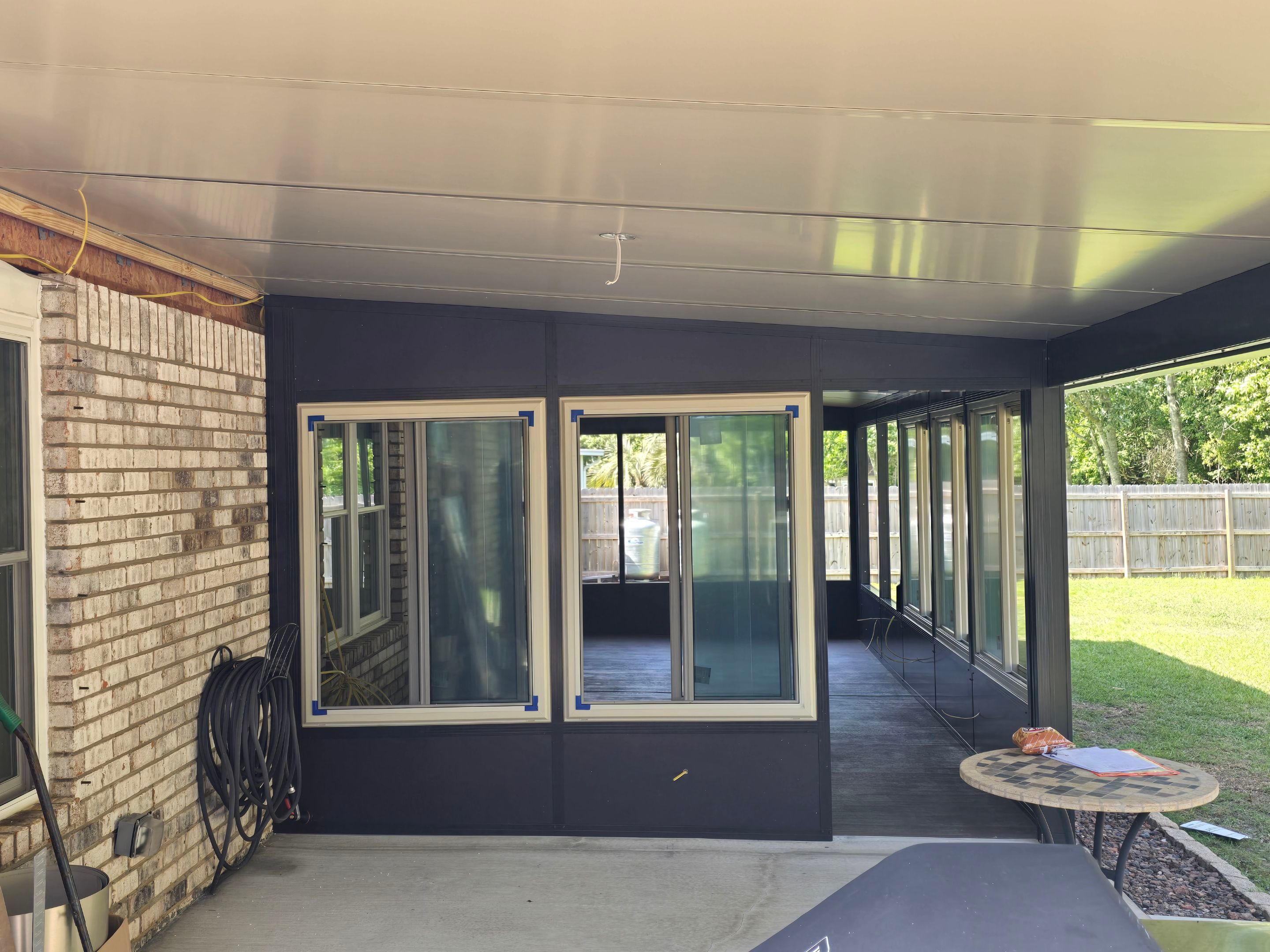 Glass Room & Patio Cover using Colorbeam by Titan Sunrooms