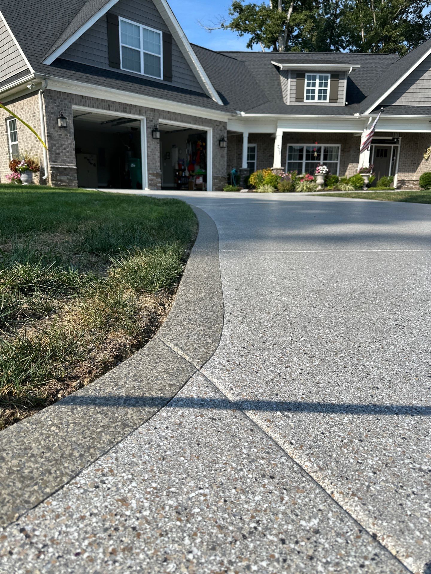 Driveway Improvement Using Claystone With Trail Mix Border! by Elite Floor Solutions
