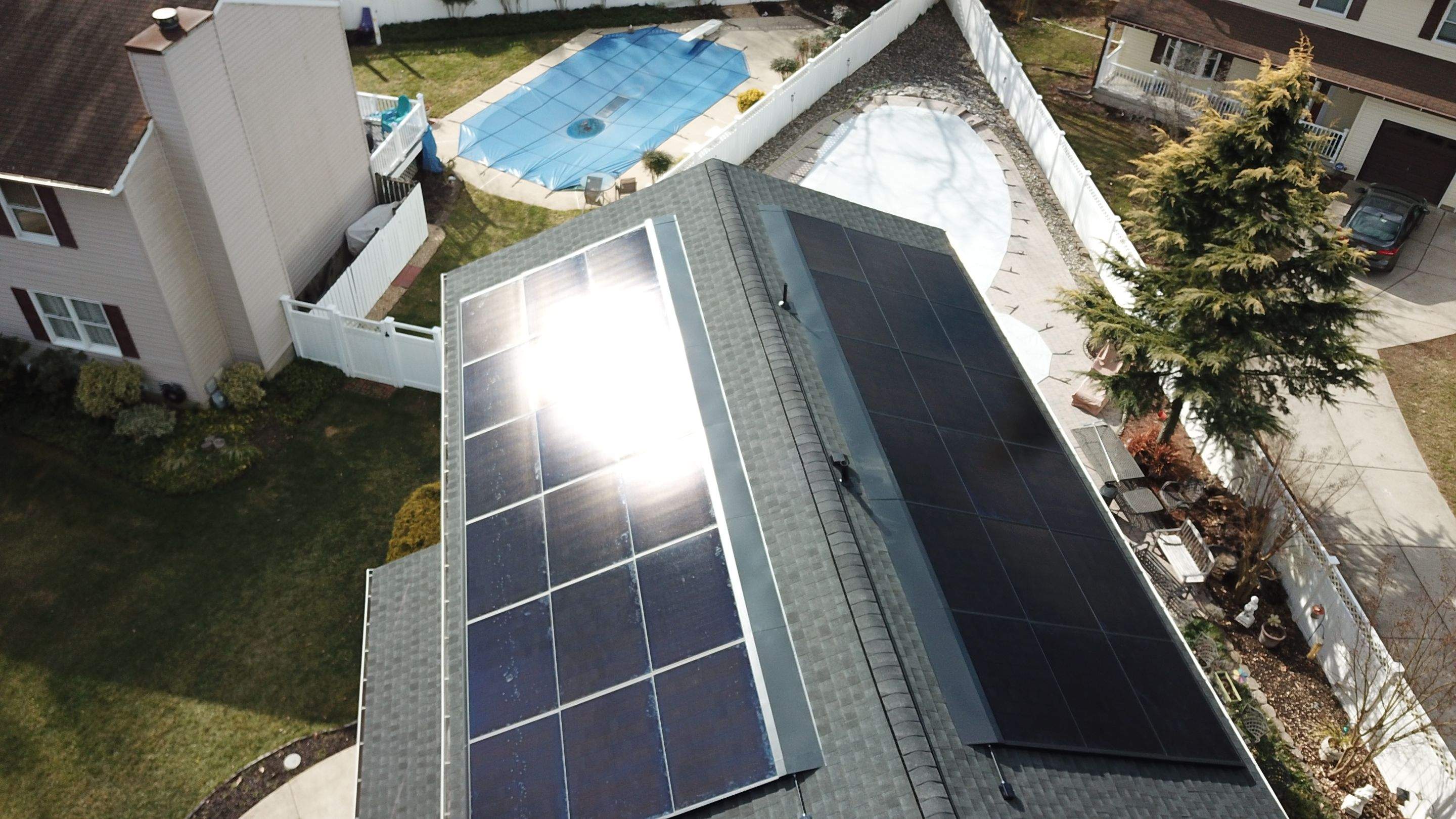 Roof Replacement with GAF Decotech integrated solar panels by American Home Contractors