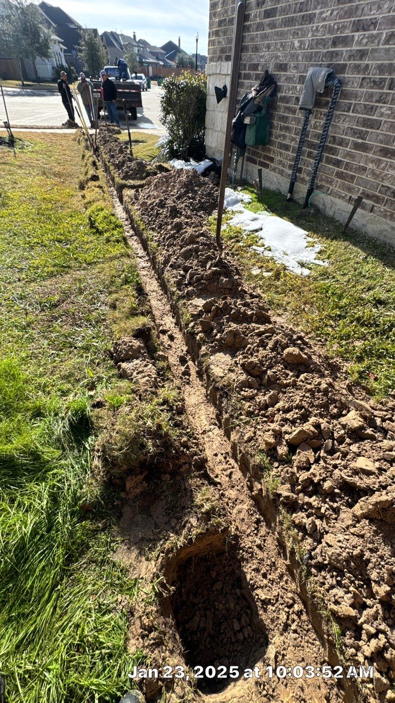 🌿✨ Darlene & Andrew’s Amazing Curb Appeal Transformation  Some projects are more than just landscaping—they’re a conversion of curb appeal from the ground up. For Darlene & Andrew, Alejandro and the Texas Urban Team designed and delivered a complete solution that reshaped their flower beds, solved drainage challenges, and gave new life to the sideyard.  💡 From planning to execution, every step was tailored to build both beauty and functionality:  🌸 Flower Beds, Reinvented  Demolition of old beds, plants, and mulch.  Fresh soil preparation, weed protection, and a brand-new retainer wall built with hand-cut stone and decorative caps.  Carefully selected plants and garden mix to ensure health and visual harmony.  💧 Drainage & Irrigation Upgrades  Outdated corrugated pipes replaced with PVC drainage lines to carry water safely away from the foundation.  New irrigation system combining drip lines and sprinklers—watering plants while keeping the house walls protected.  Sideyard drainage extended with catch basins and PVC piping to prevent water pooling and foundation stress.  🚶 Functional Sideyard with Walkway & Trash Area  Graded and leveled sideyard to manage runoff.  Installed a modern gravel and paver walkway for easy access.  Built a firm and tidy concrete-paver pad for trash containers—making the space both practical and polished.  🛠️ Stonework & Craftsmanship  Every stone in the retainer wall was cut, set, and secured by the team of handcrafters, ensuring a durable build that doubles as a design statement.  ✅ Outcome: Darlene & Andrew’s property now has better drainage, a clean and organized sideyard, and elegant new flower beds—all designed for long-term durability and lasting beauty.  📢 Before hiring anyone, review our portfolio. Our work speaks louder than words—each project is a blend of function, protection, and design crafted to last. by Texas Urban Elements