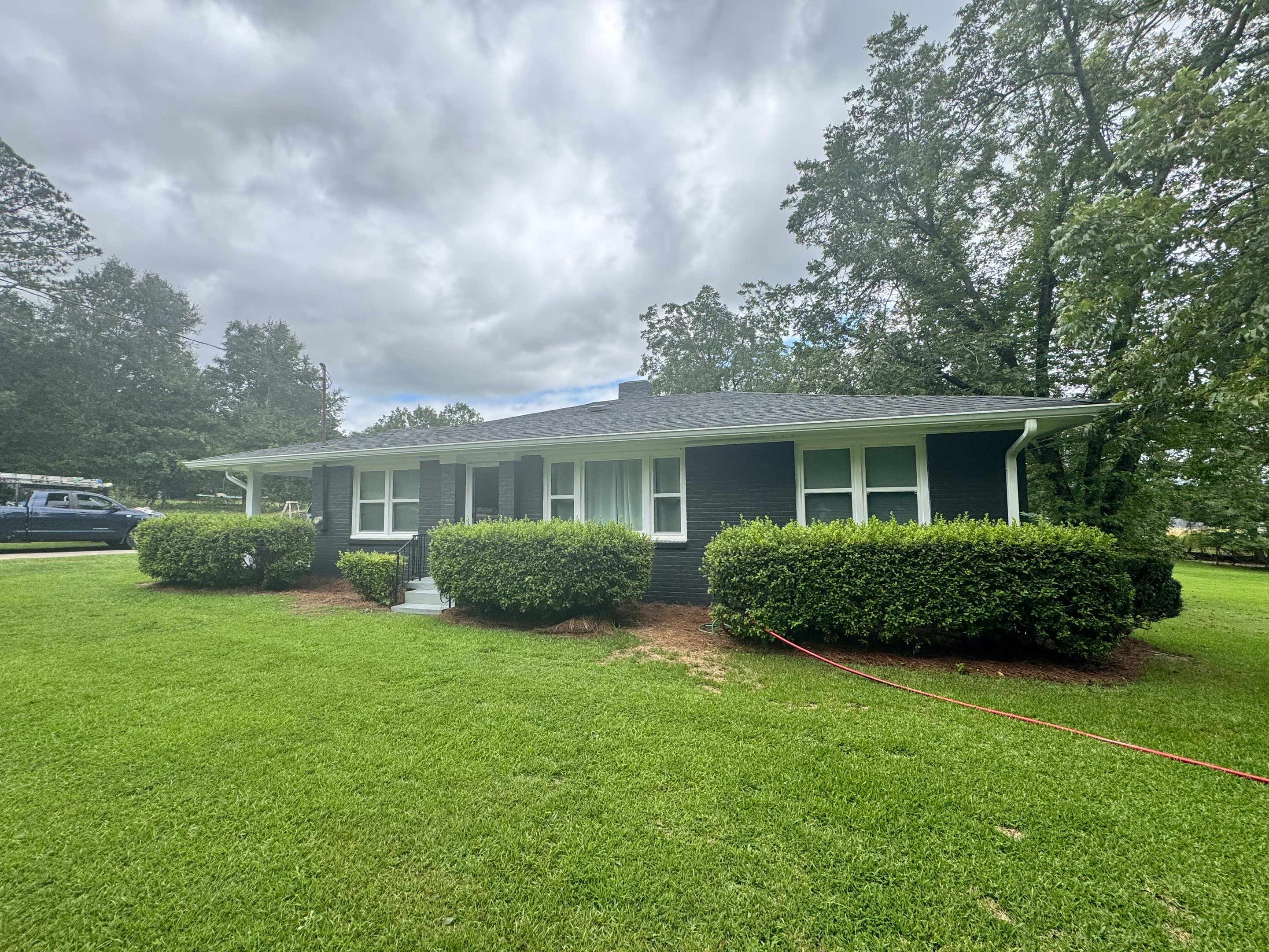 Social Circle Masonry Transformation with Dark Charcoal Exterior Painting by PGP Surface Solutions, LLC