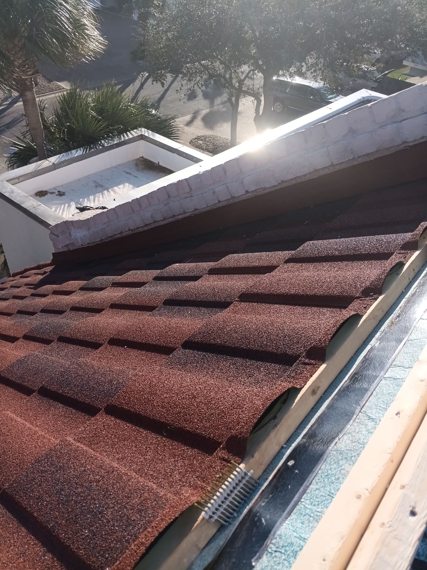 Off with the Tile and on with the TILCOR stone coated metal.  by Bayfront Roofing and Construction
