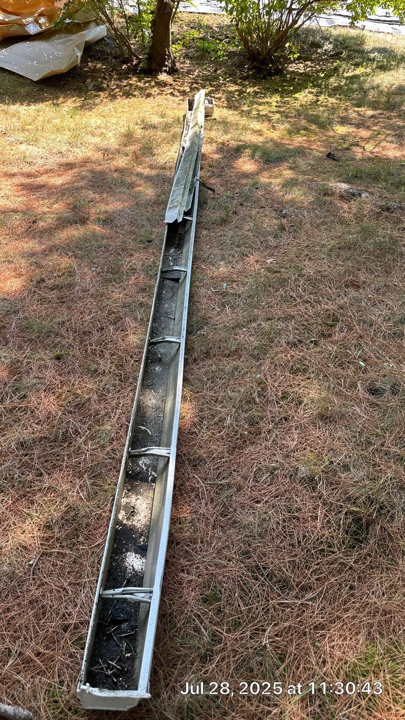 Complete Roof Replacement with Chimney Flashing, Gutter Guard System, and Vinyl Siding Repairs by Mighty Dog Roofing of Greater Middlesex County