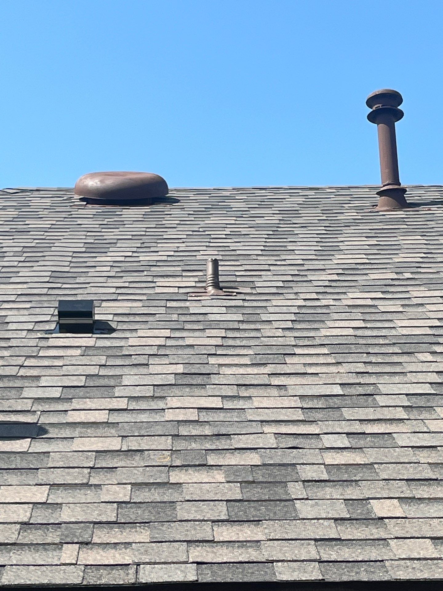 Medium brown brick with IKO Driftshake by Tejas Roofworks + Restoration