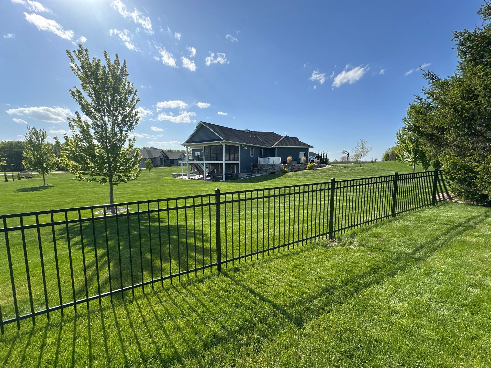 Black Ornamental Metal Picket Fence Installation in Waterloo by Perfect Picket Fence and Stain
