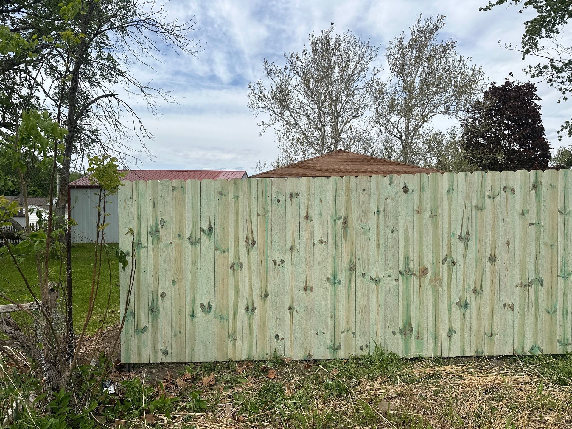 Pressure-Treated Wood Privacy Fence Installation in Waterloo by Perfect Picket Fence and Stain