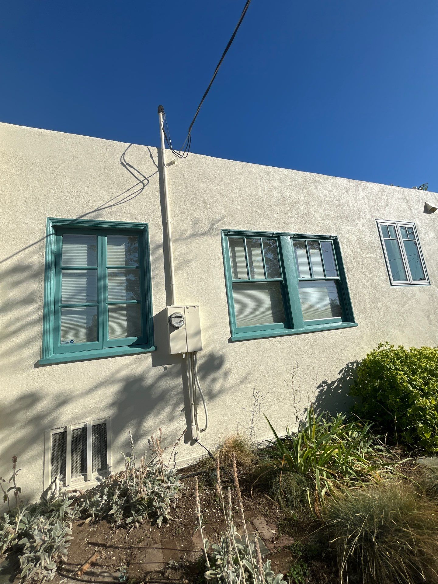 Exterior Transformation with Fresh Stucco and elastomeric system for waterproofing by Herrera’s Bay Area Painting inc.