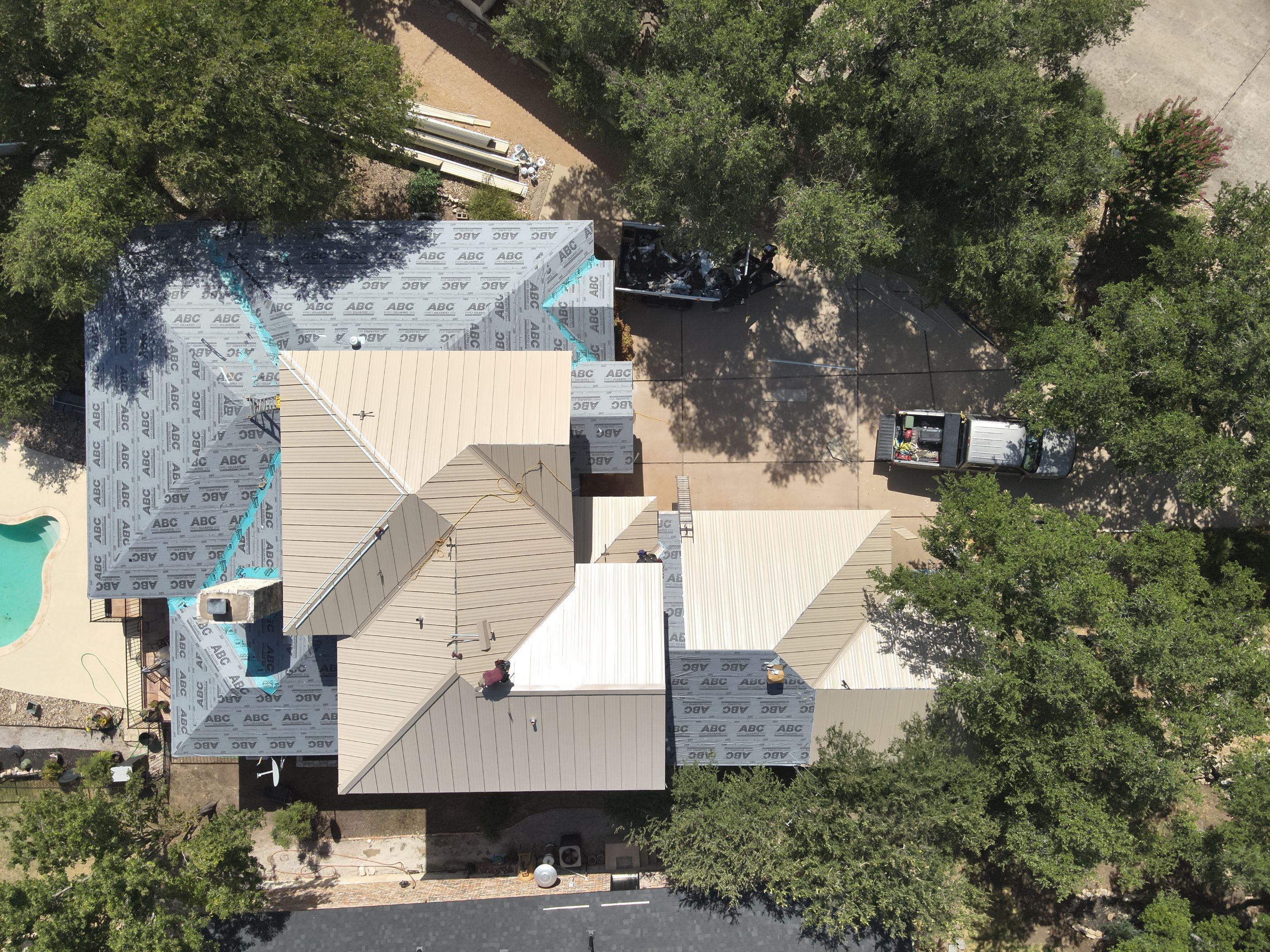 Residential Roof Replacement using 24 GA Double-Lock - Surrey Beige by Action Exteriors Austin