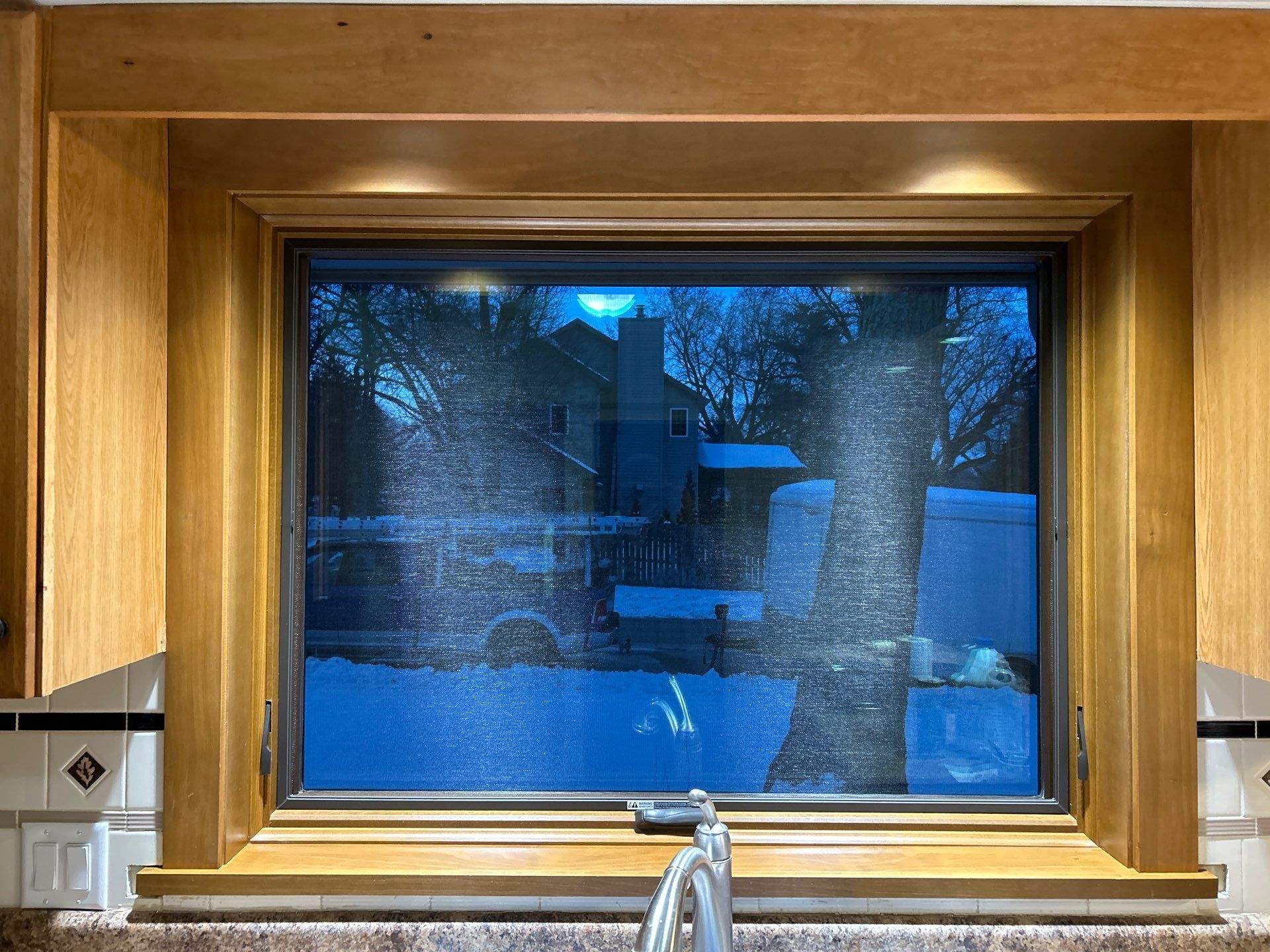 Black-Frame Pella Lifestyle Upgrade on a Partial Brick Home by United Windows and Siding LLC