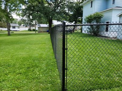 Black Vinyl Coated Chain Link Fence Installation in Independence