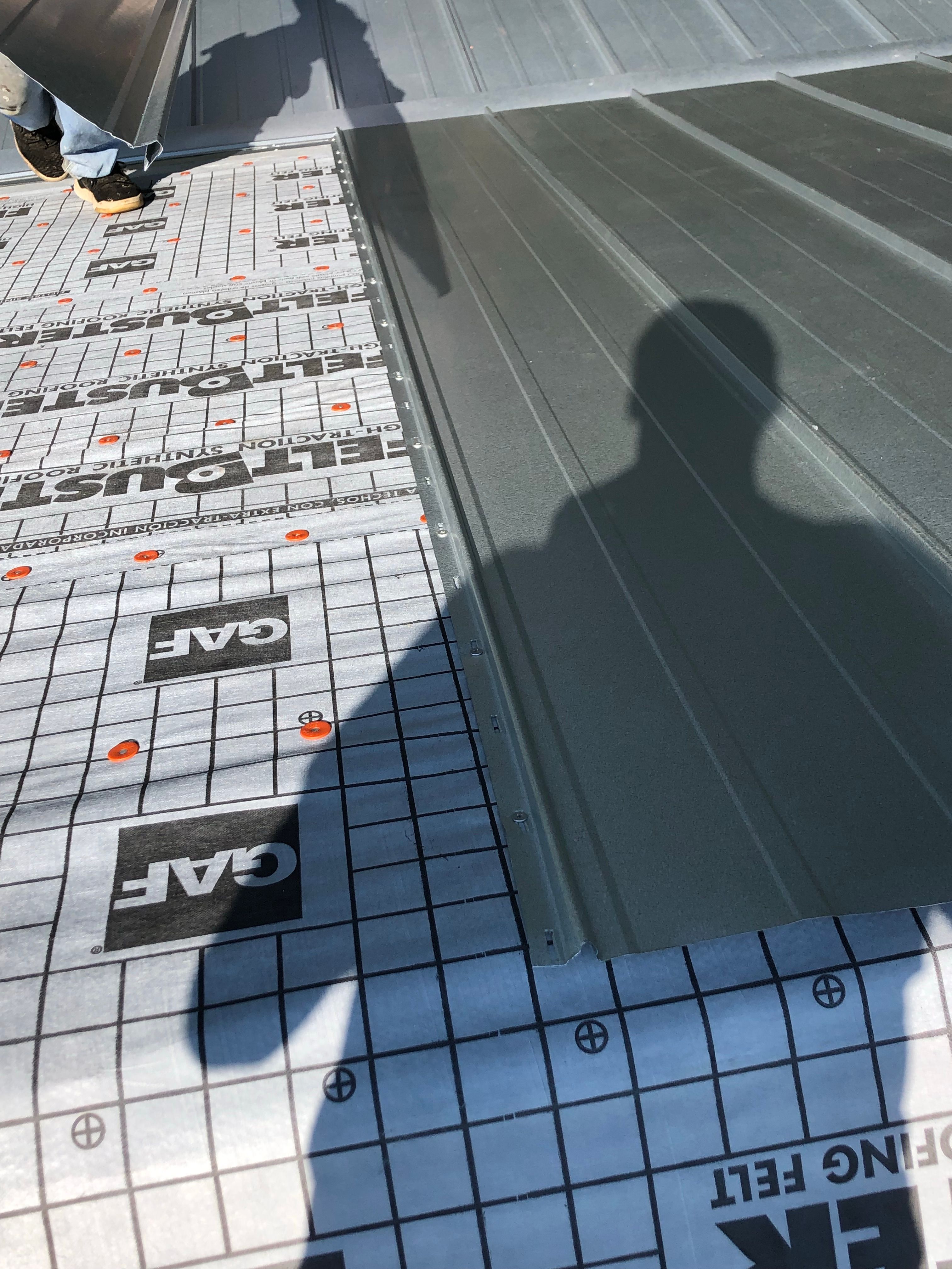 Residential Roofing Installation using Metal roofing by American Roofing & Construction LLC
