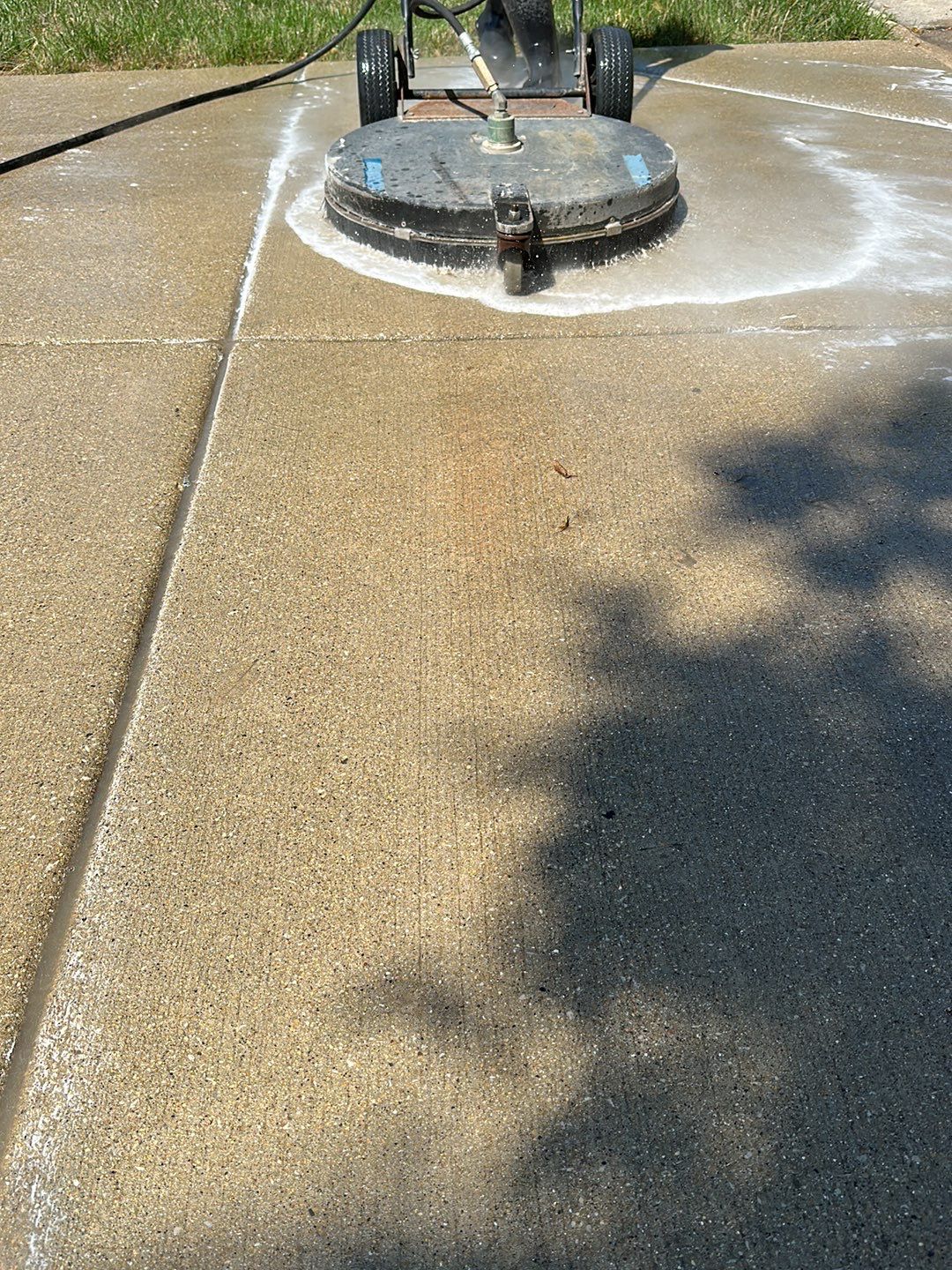 Oil extraction from concrete driveway.  by Northern Power Washing LLC.