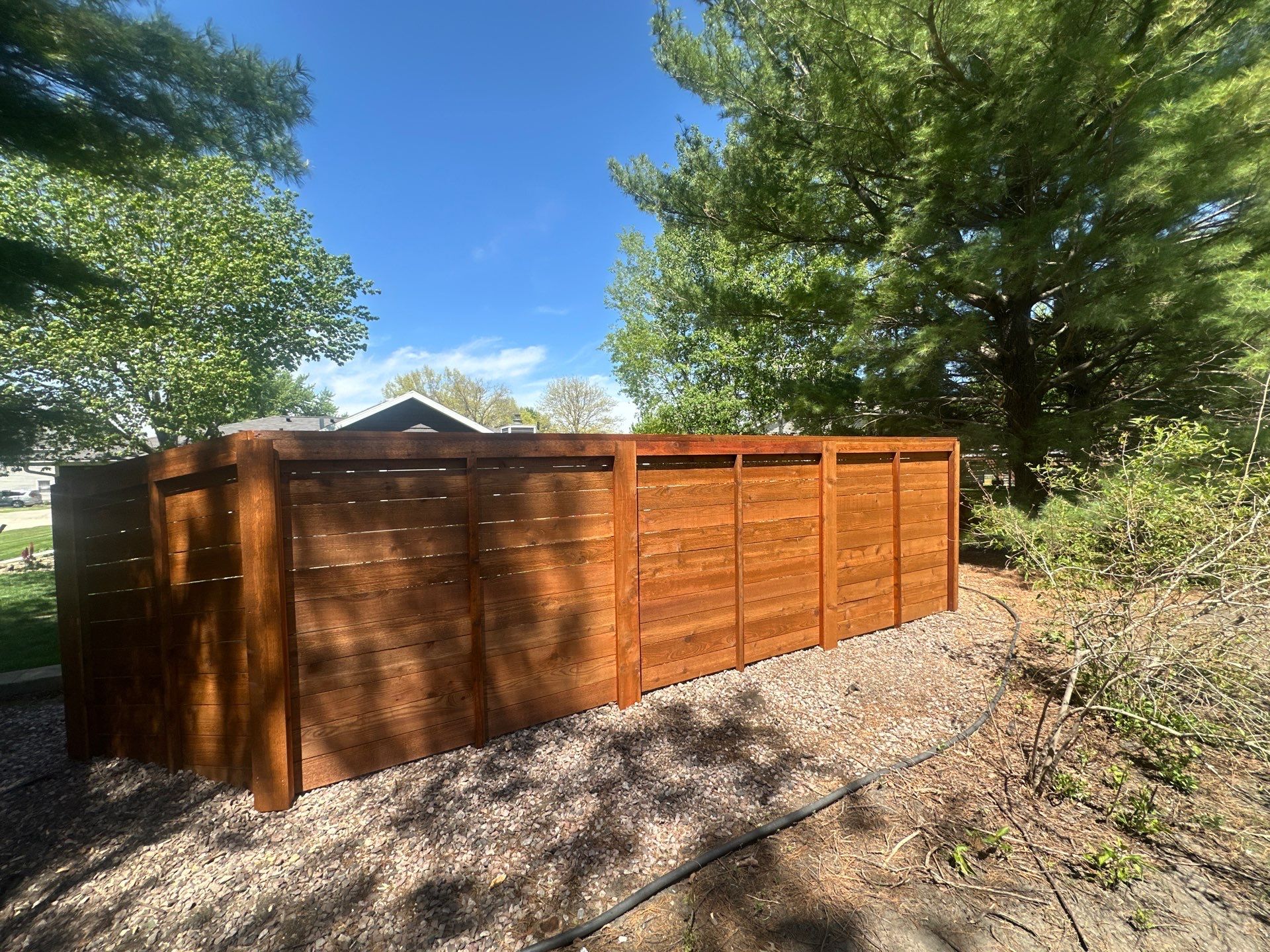 Horizontal Stained Wood Privacy Fence Installation in Waterloo by Perfect Picket Fence and Stain