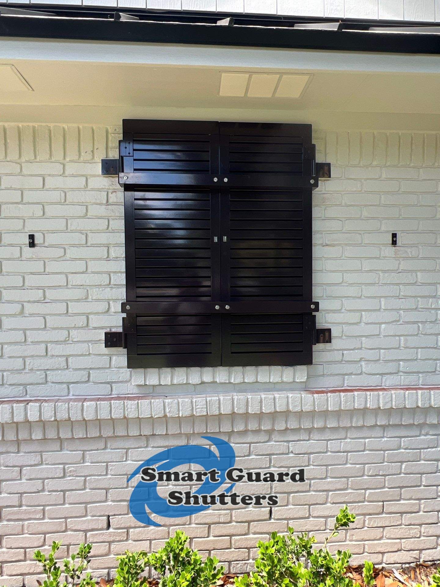 Impact Colonial & Bahama Shutters in Jet Black by Smart Guard Shutters