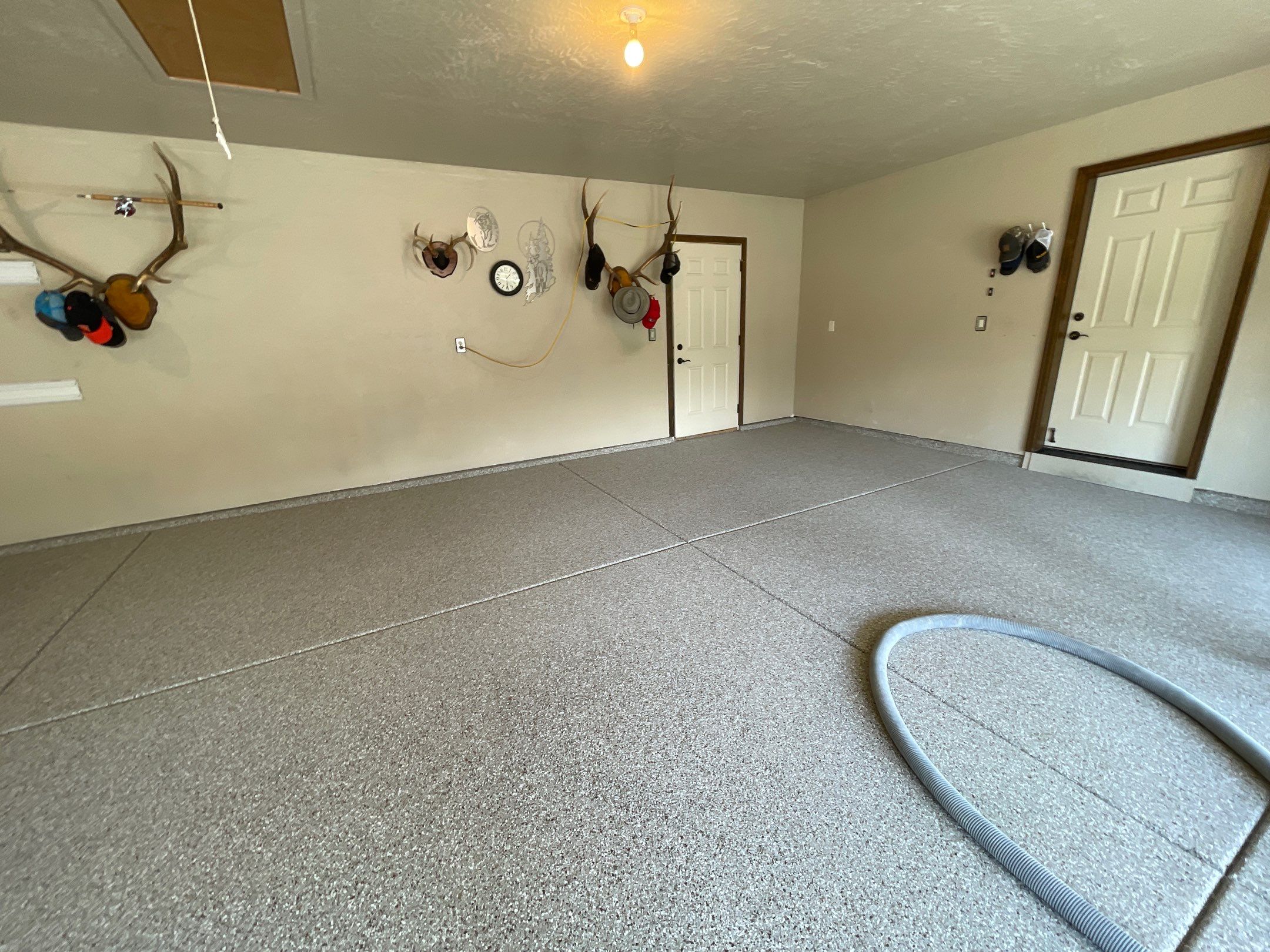 Garage Transformation using Pebble Beach and Front Porch using Greystone by Croc Coatings, LLC