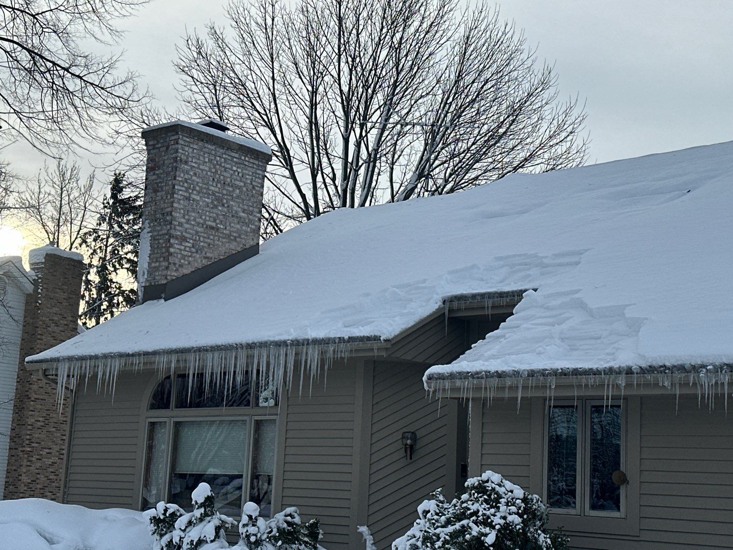 Roof Snow And Ice Dam Removal using Steamer by Stendahl Services