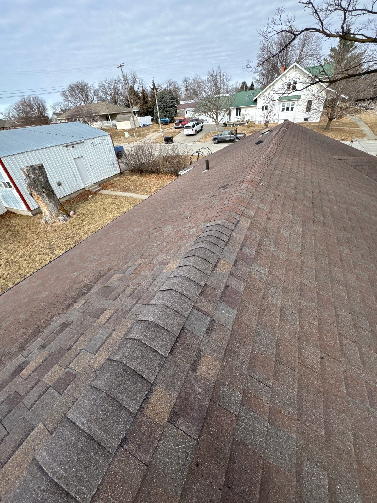 Shingle Roof Repair and Ridge Cap Replacement in Beemer, NE by Crows Roofing LLC