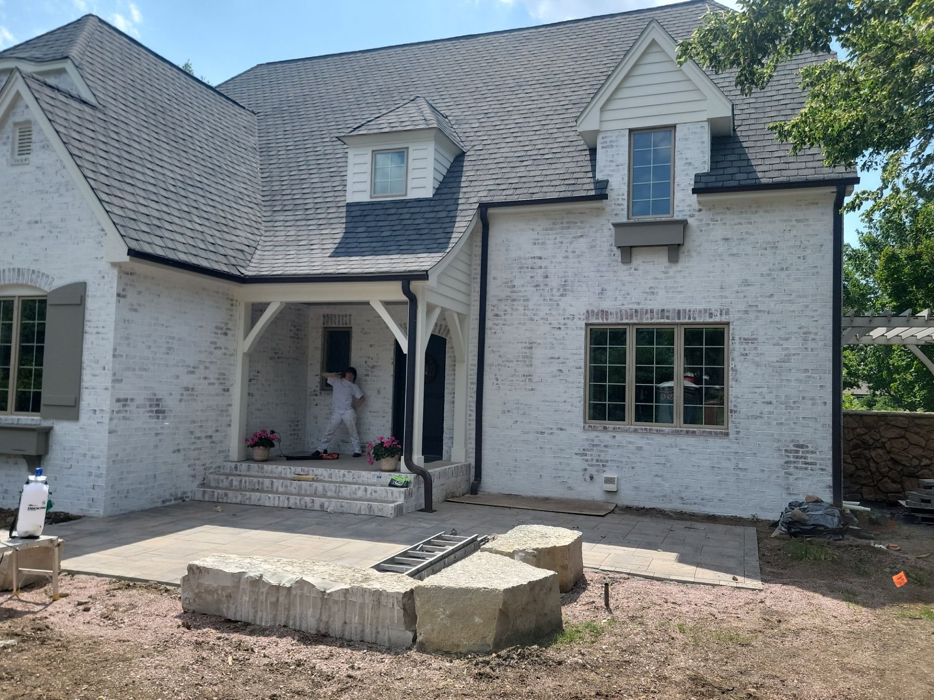Residential Exterior Brick Painting and Limewash Refresh in Sioux Falls by Select Painting, Coatings & Garage Cabinets