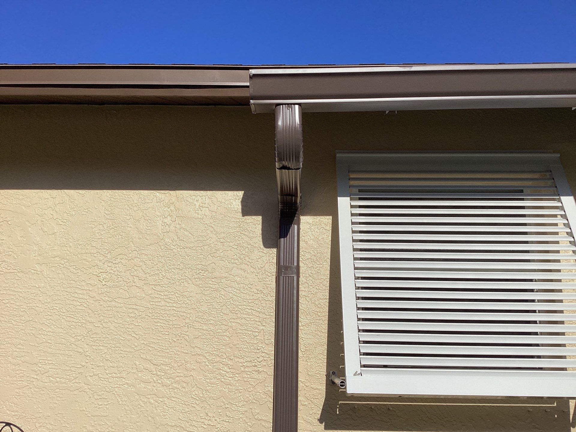 Musket Brown Seamless Gutters using Royal Brown by Gutter Professors