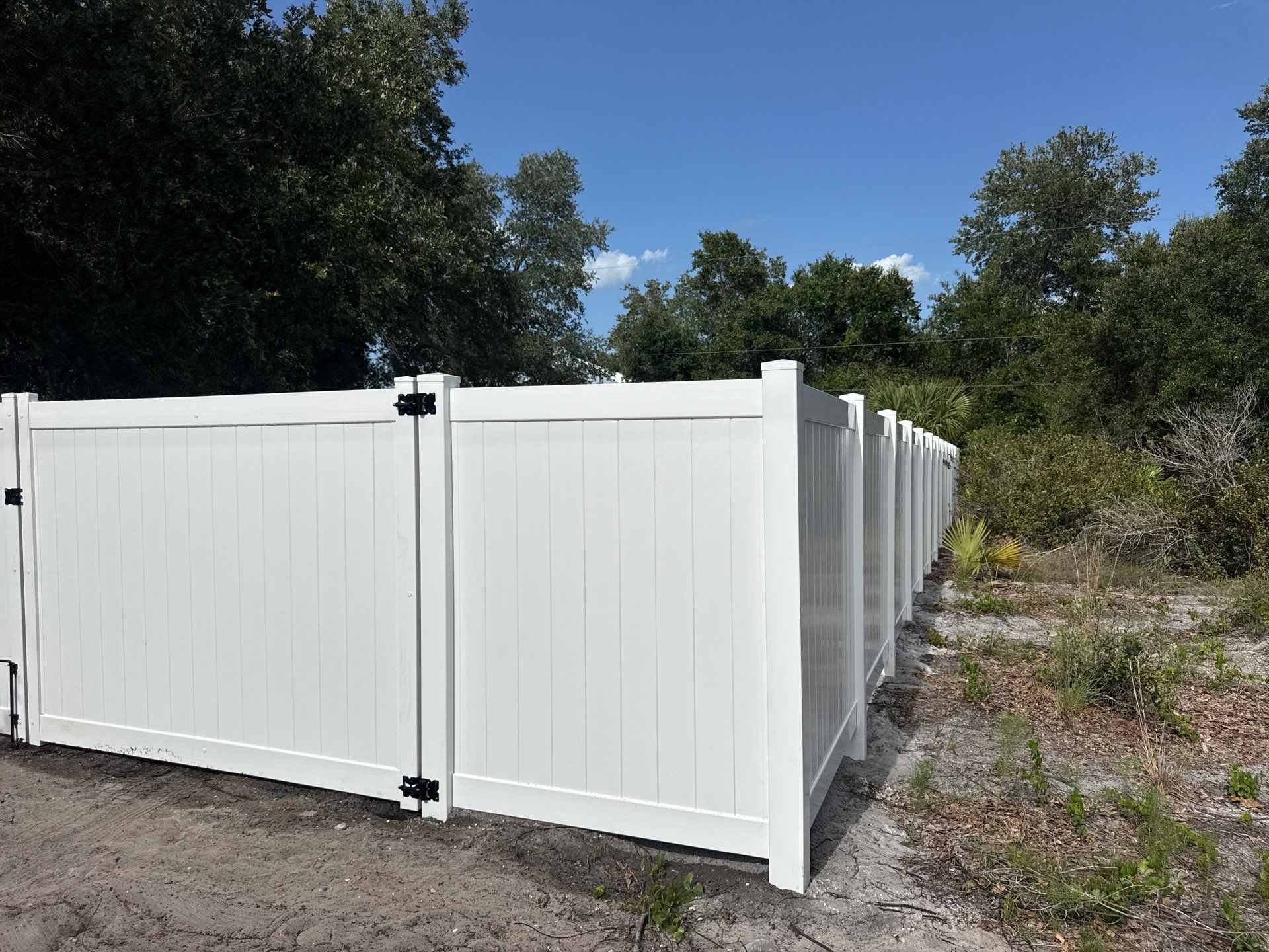White Vinyl Privacy Fence Installation and Gate Assembly in Punta Gorda by True Fence LLC