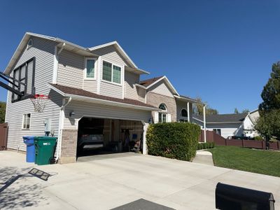 Orem | Complete Vinyl Siding Upgrade & Gutters | Pebblestone Clay