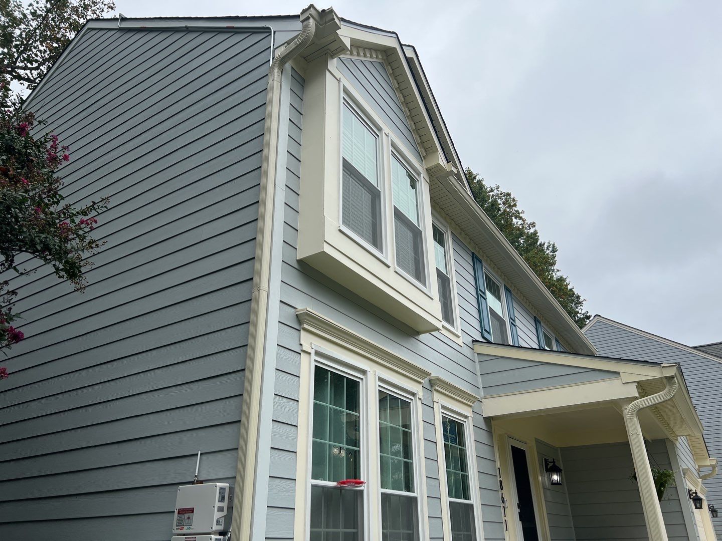 Exterior Home Makeover using GAF Timberline HDZ, GAF Decotech, and James Hardie Siding by American Home Contractors
