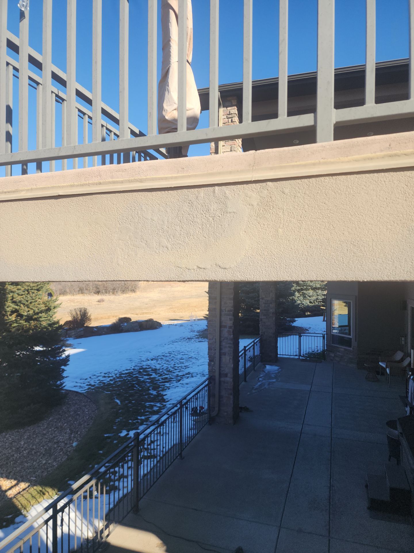 Castle Rock Elegance: White Stucco Exterior with Bold Tricorn Black by J&M Painting LLC