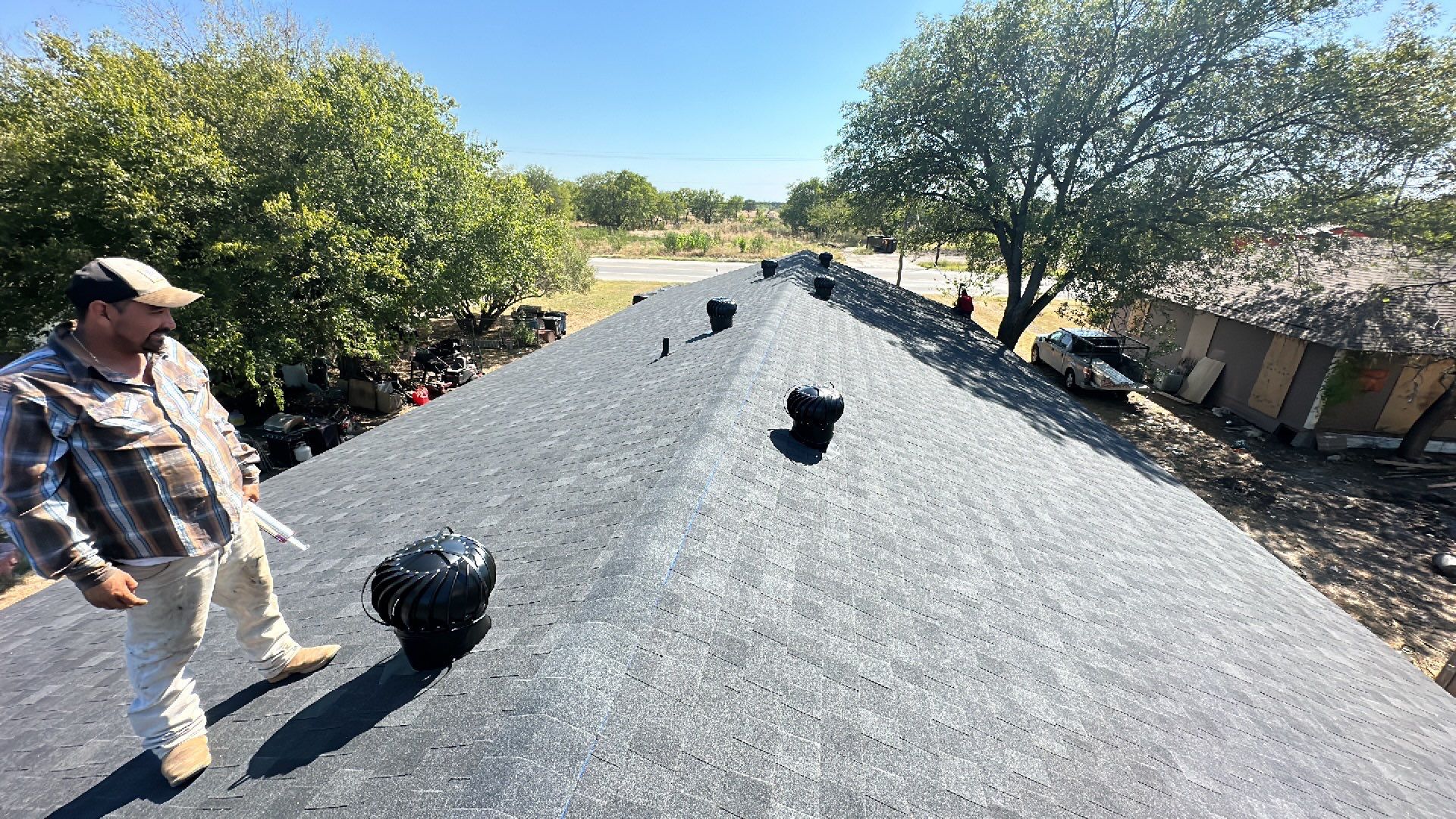 Atlas-Pristine Black with White Siding by Tejas Roofworks + Restoration