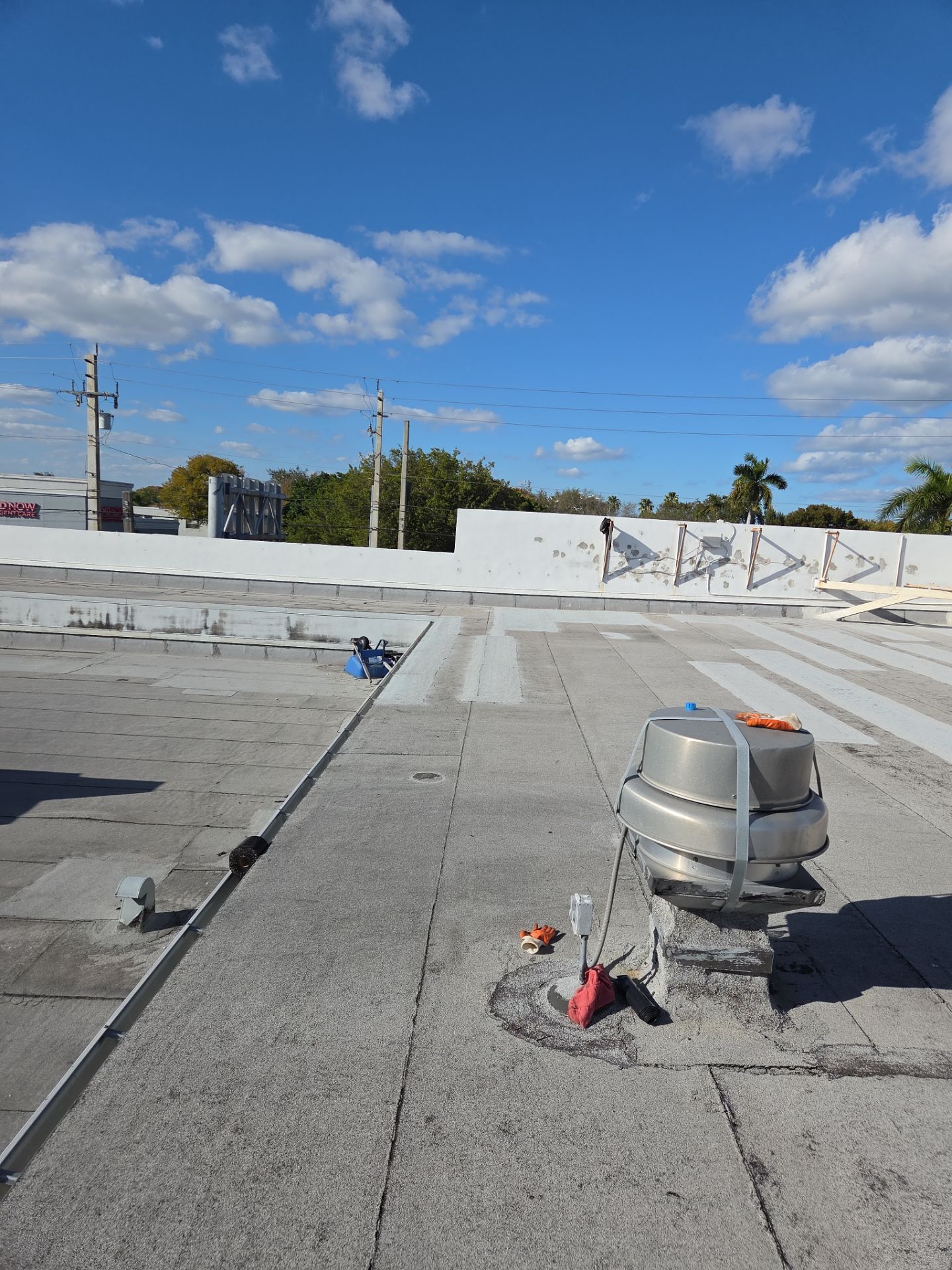 Commercial Flat Roof Restoration Using Silicone Coating in Hallandale Beach by Aastro Roofing