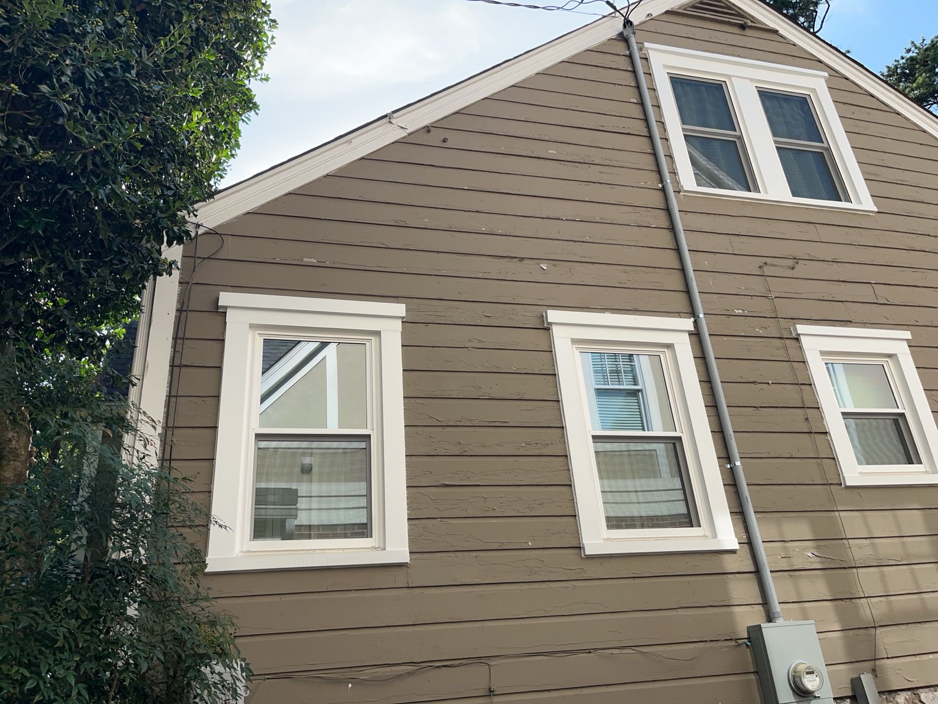 Full Siding Replacement, Deck Build, Exterior Paint, and Gutter Replacement  by Nelson Exteriors 