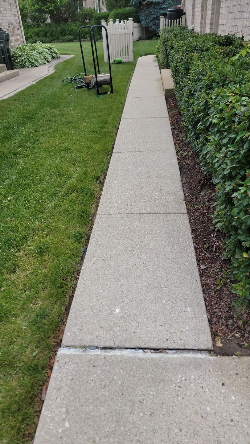 concrete power washing Algaecide, soft wash soap by Northern Power Washing LLC.