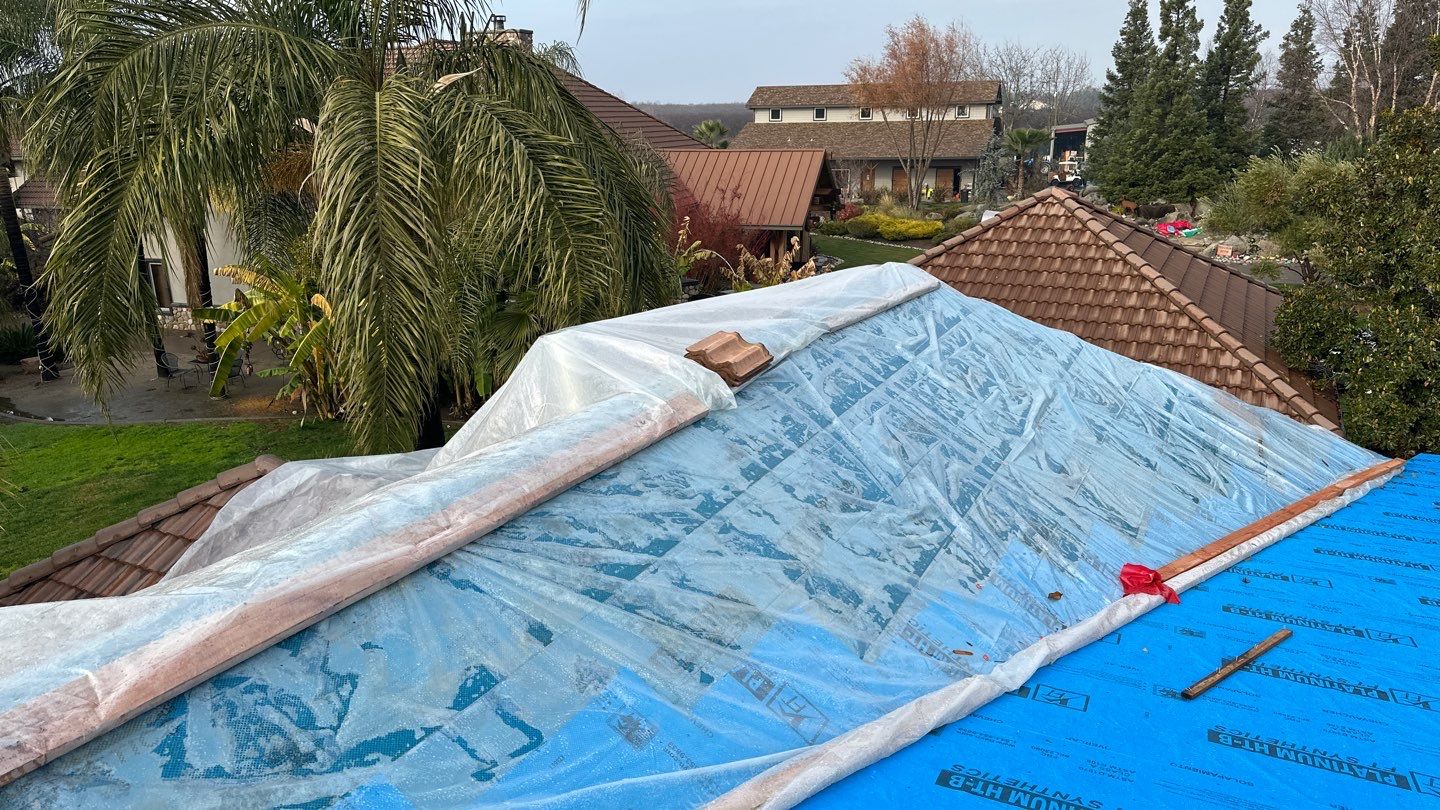 Tile, Metal, and TPO roofing project (new construction) by Straight Edge Roofing Inc