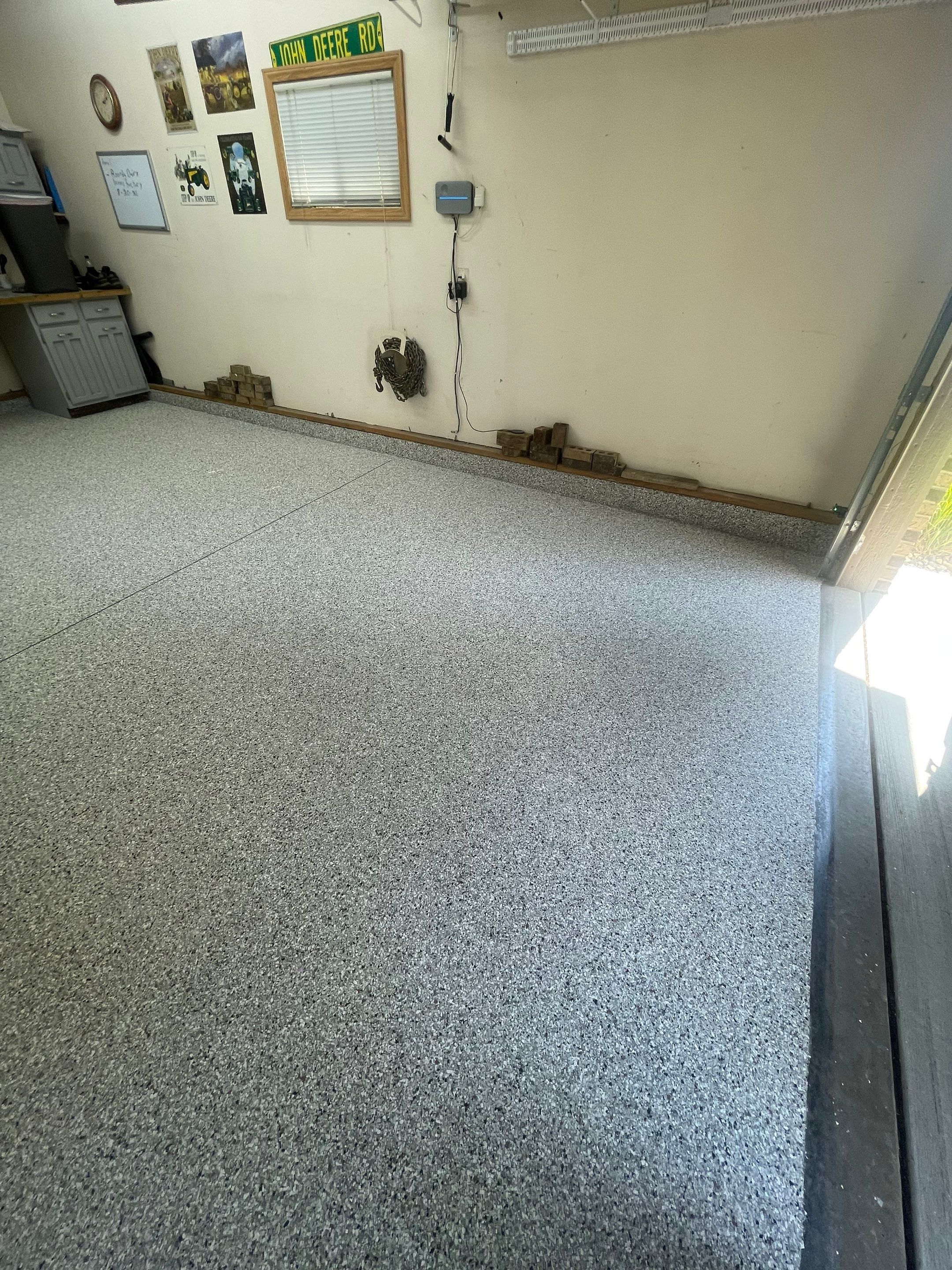 Multi-Stall Garage Floor Coating Installation in Sioux Falls by Select Painting, Coatings & Garage Cabinets