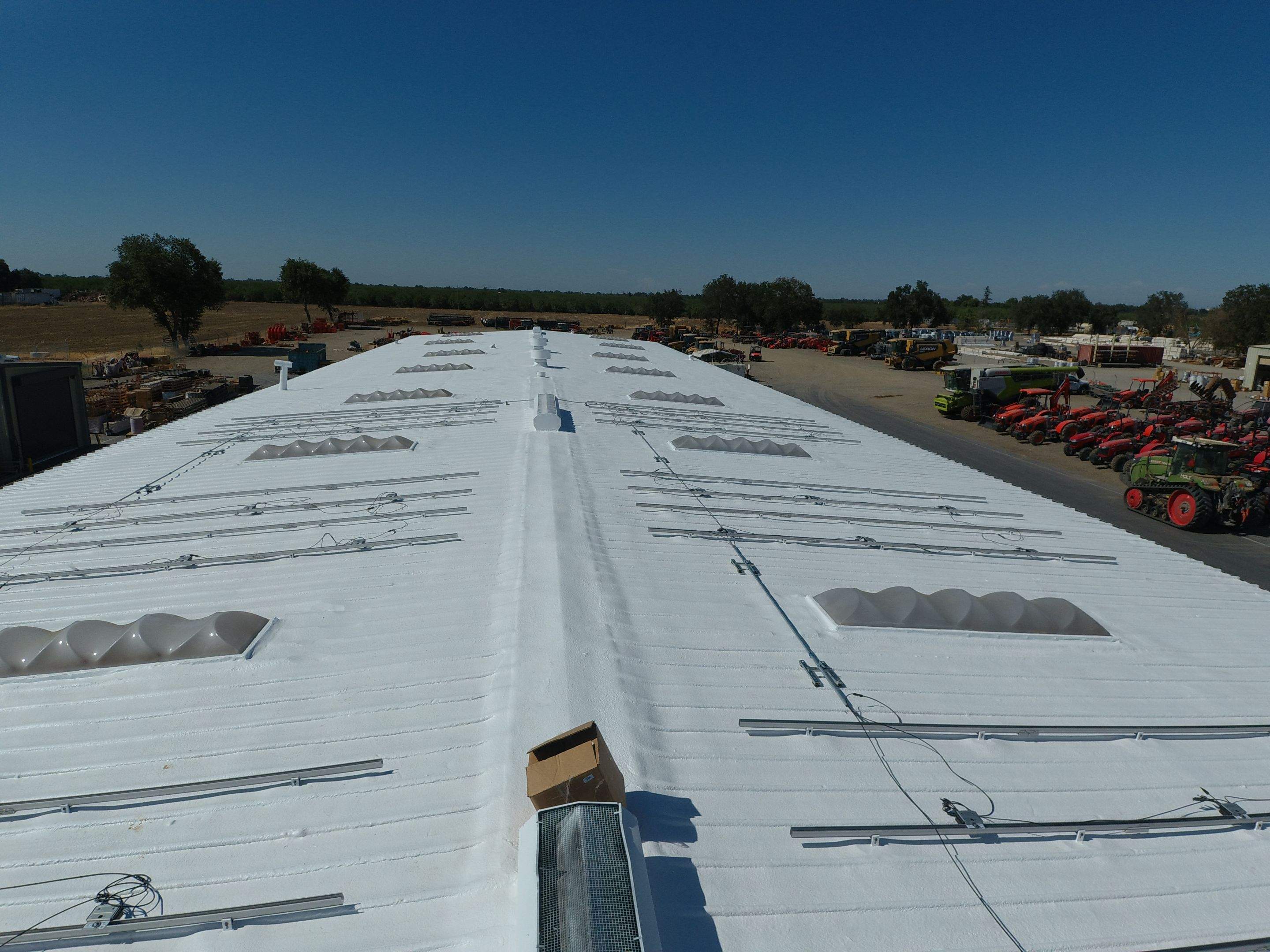 Spray foam and coatings using Conklin Benchmark/PUMA XL coatings and spray foam by Straight Edge Roofing Inc