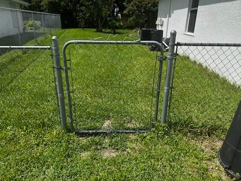 Residential Chain Link Fence and Swing Gate Installation in Naples by True Fence LLC