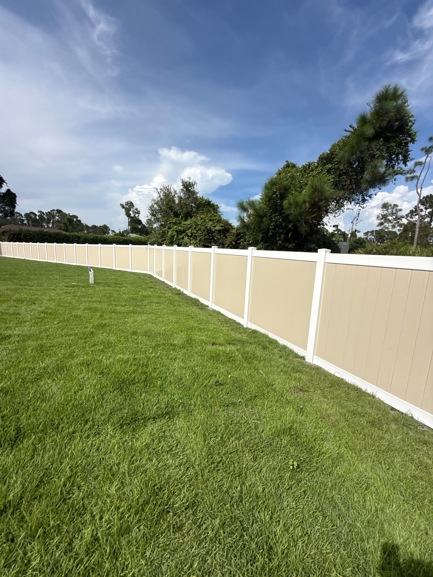 Custom Two-Tone Vinyl Privacy Fence Installation in North Port by True Fence LLC