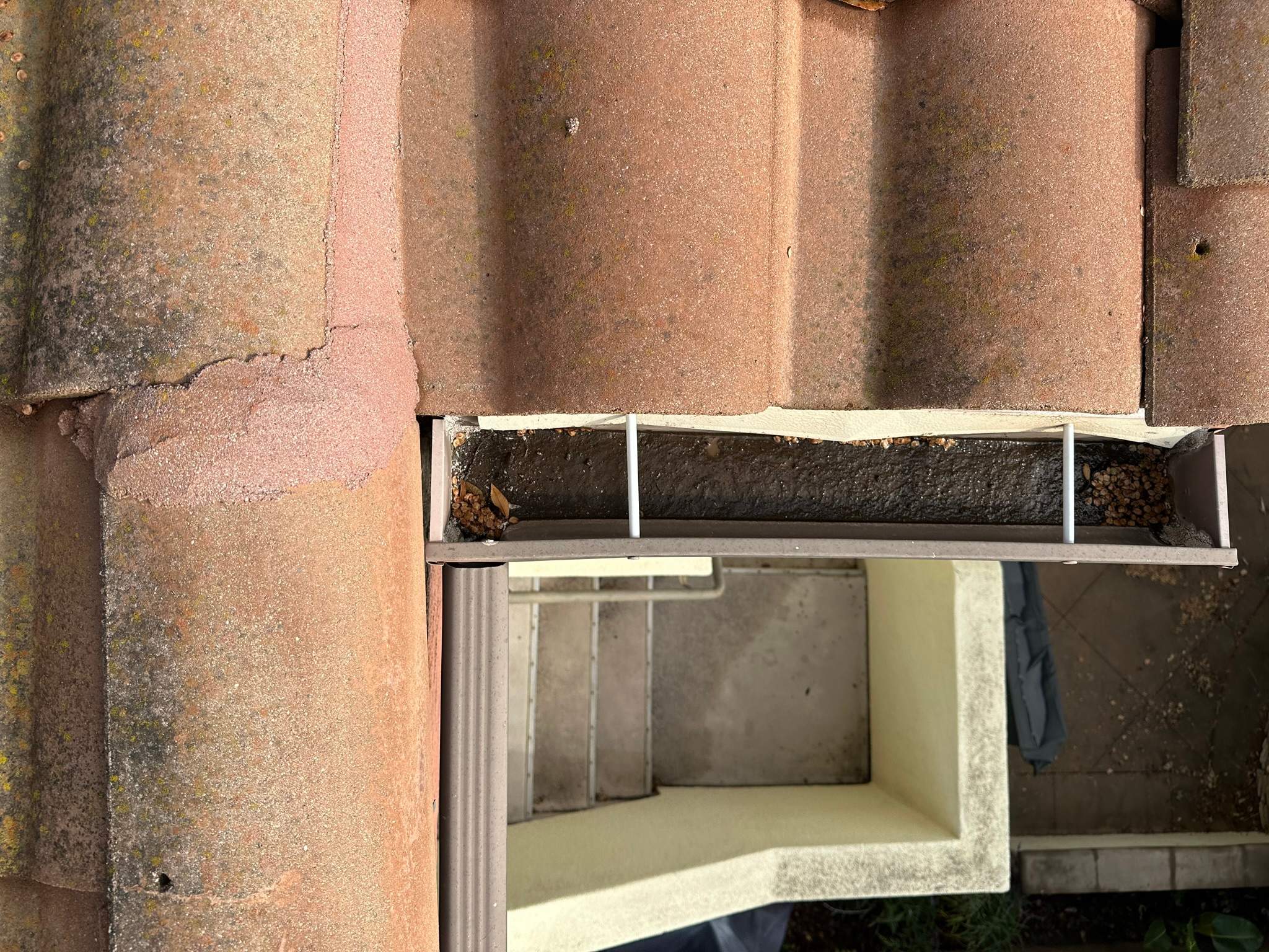 Clogged gutters at this Irvine home in Woodbury by Property Cleaning Experts, LLC