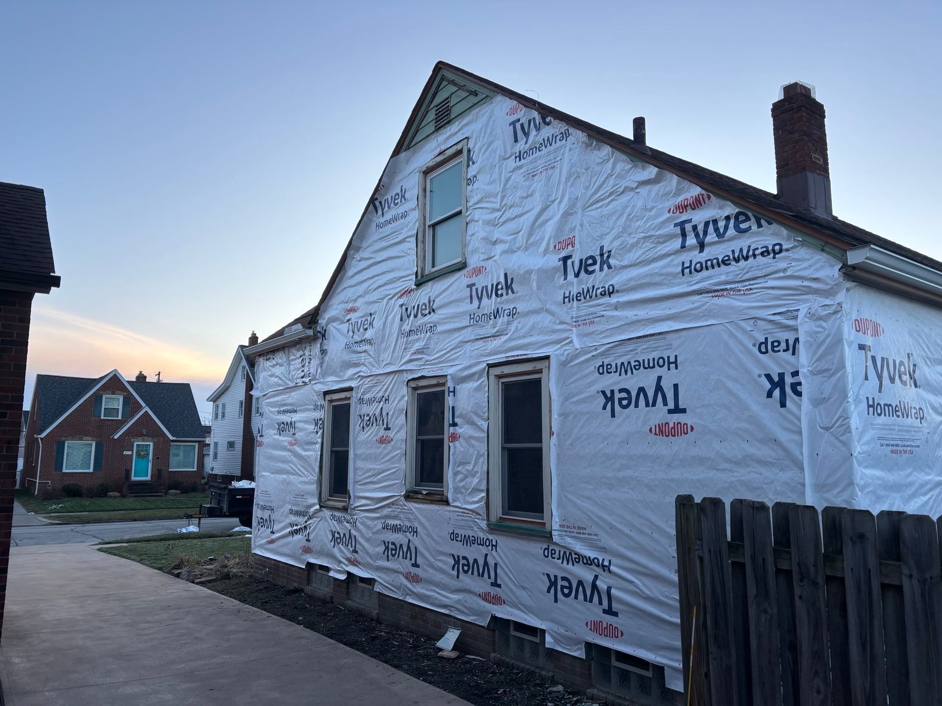 Full Exterior Siding and Awning Transformation in Parma by Cornerstone Roofing And Siding