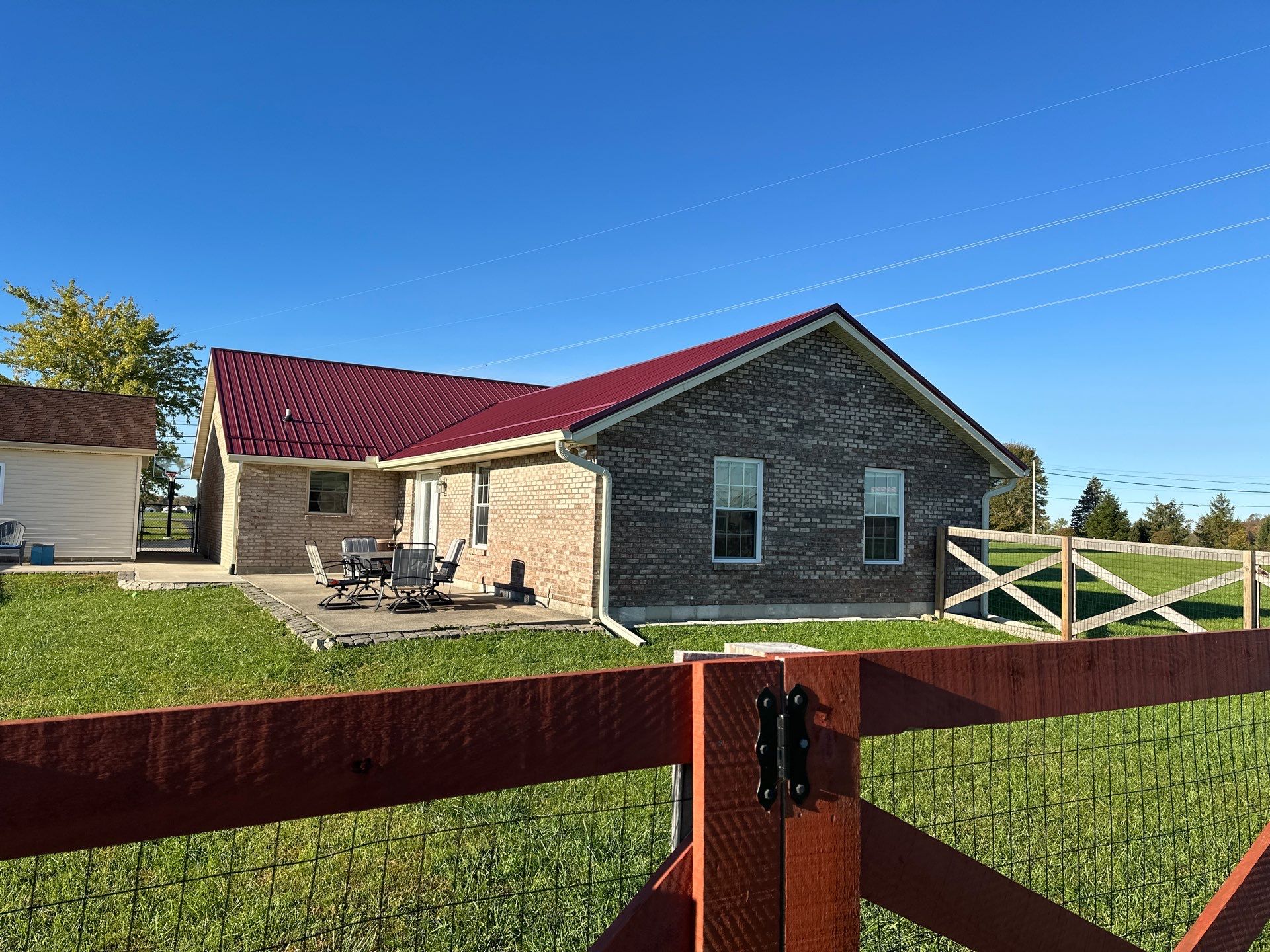 Residential Roofing Installation using Performance Panel Metal - Burgandy by RoofX 