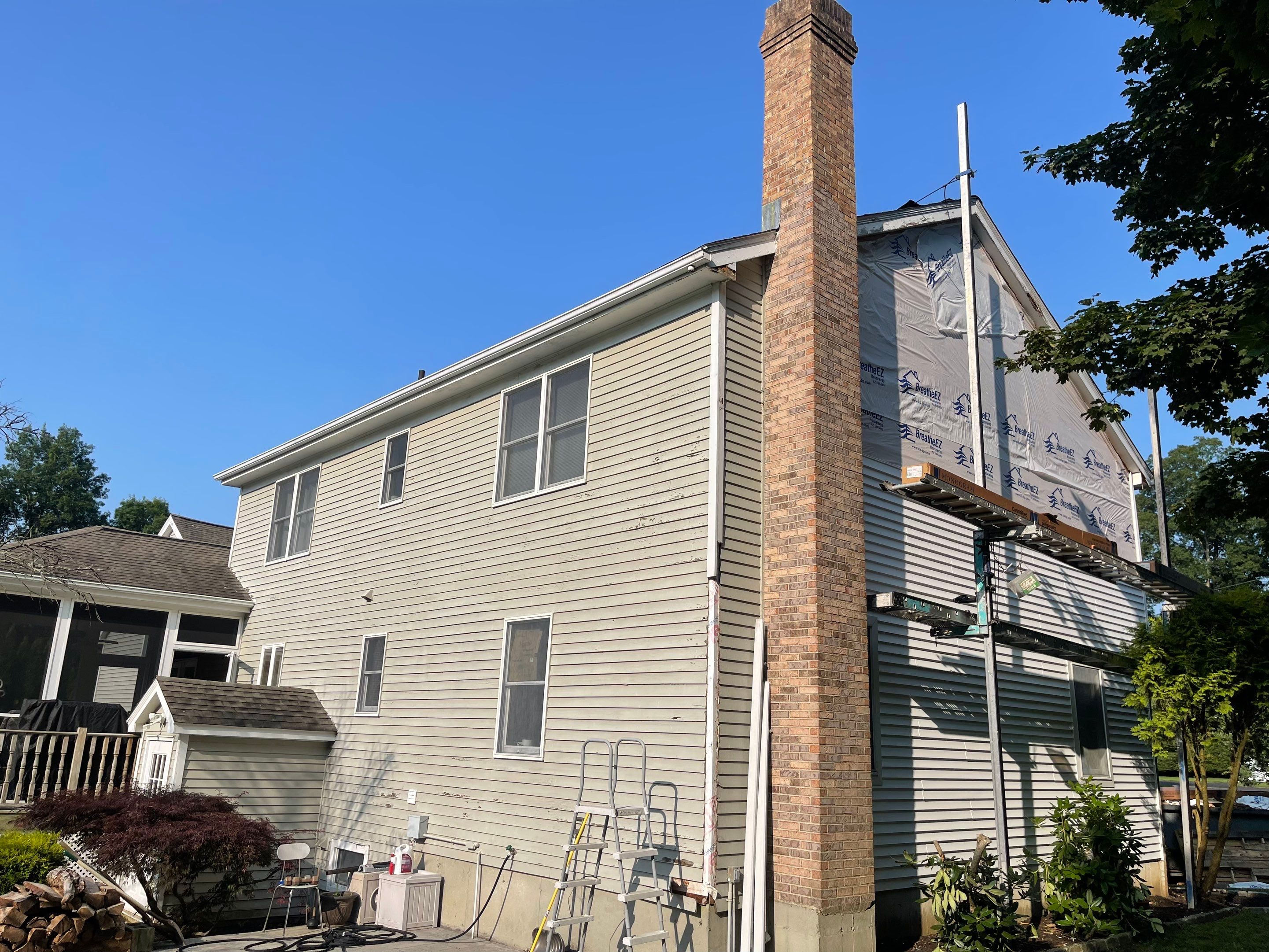 Siding Installation using Mainstreet Colonial & White gutters by A Plus Exterior
