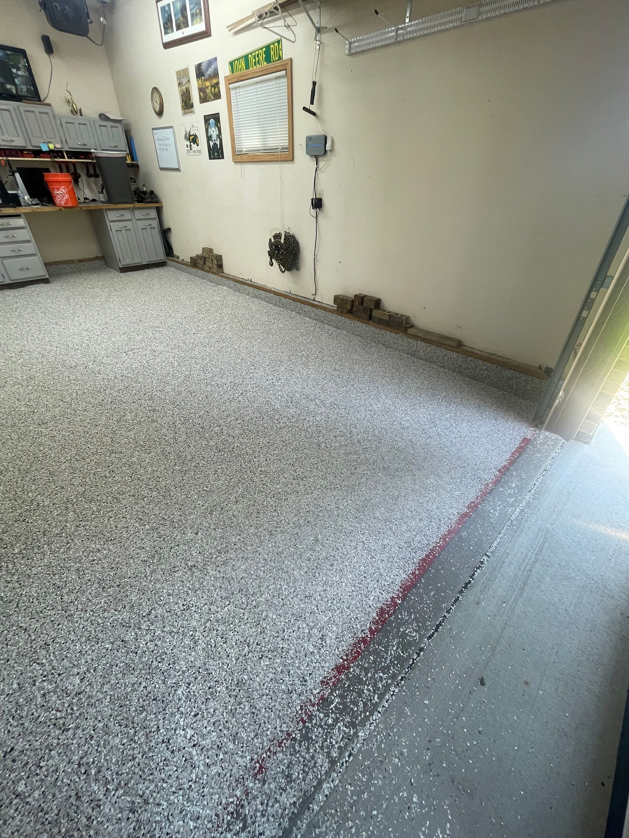 Multi-Stall Garage Floor Coating Installation in Sioux Falls by Select Painting, Coatings & Garage Cabinets