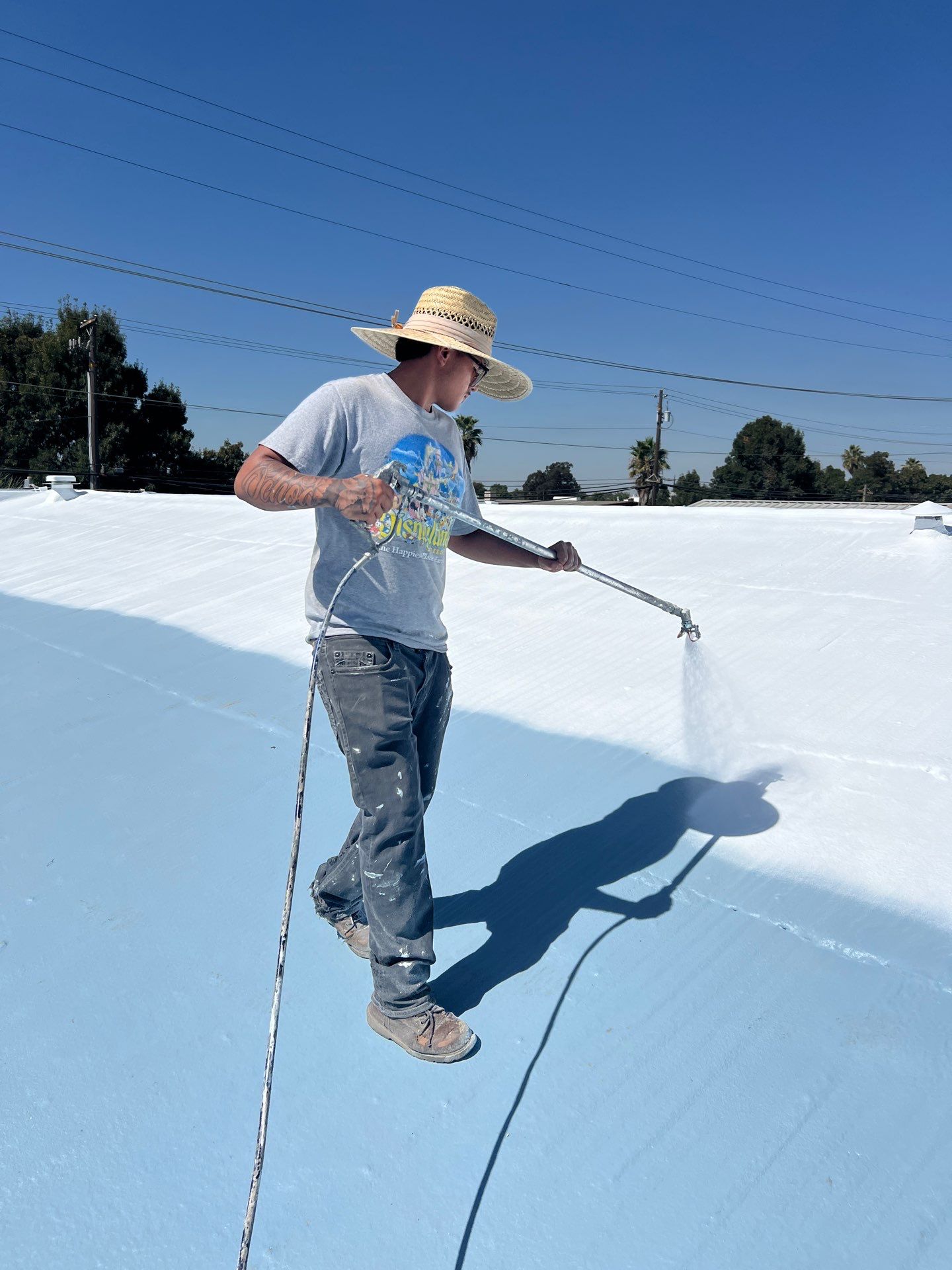 Spray foam and coatings using Conklin Benchmark/ PUMA XL acrylic coatings over metal and foam by Straight Edge Roofing Inc