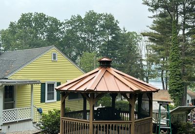 Residential Roofing Installation using Copper Penny Metal Roof