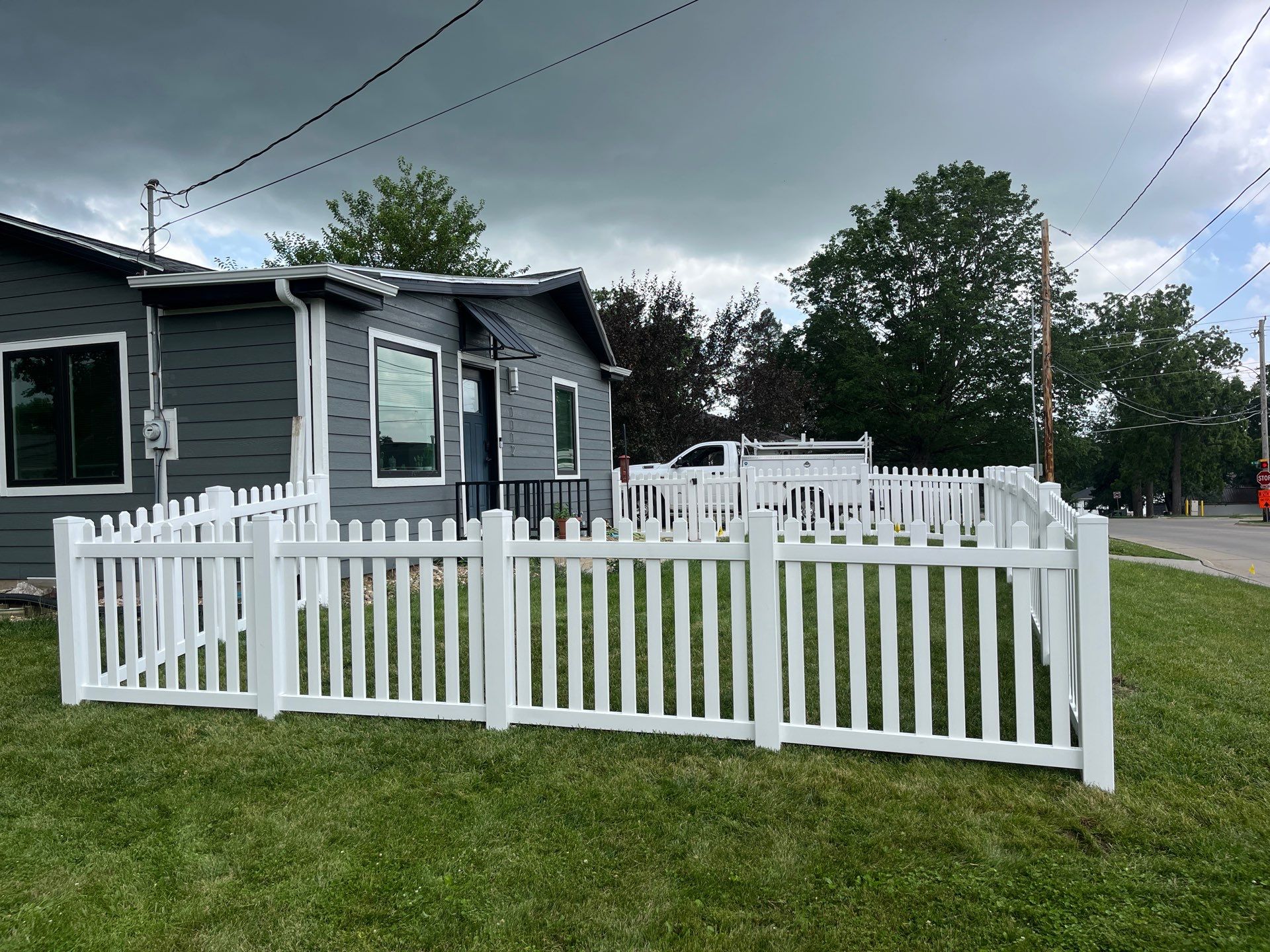White Vinyl Spaced Picket Fence Installation in Cedar Falls by Perfect Picket Fence and Stain