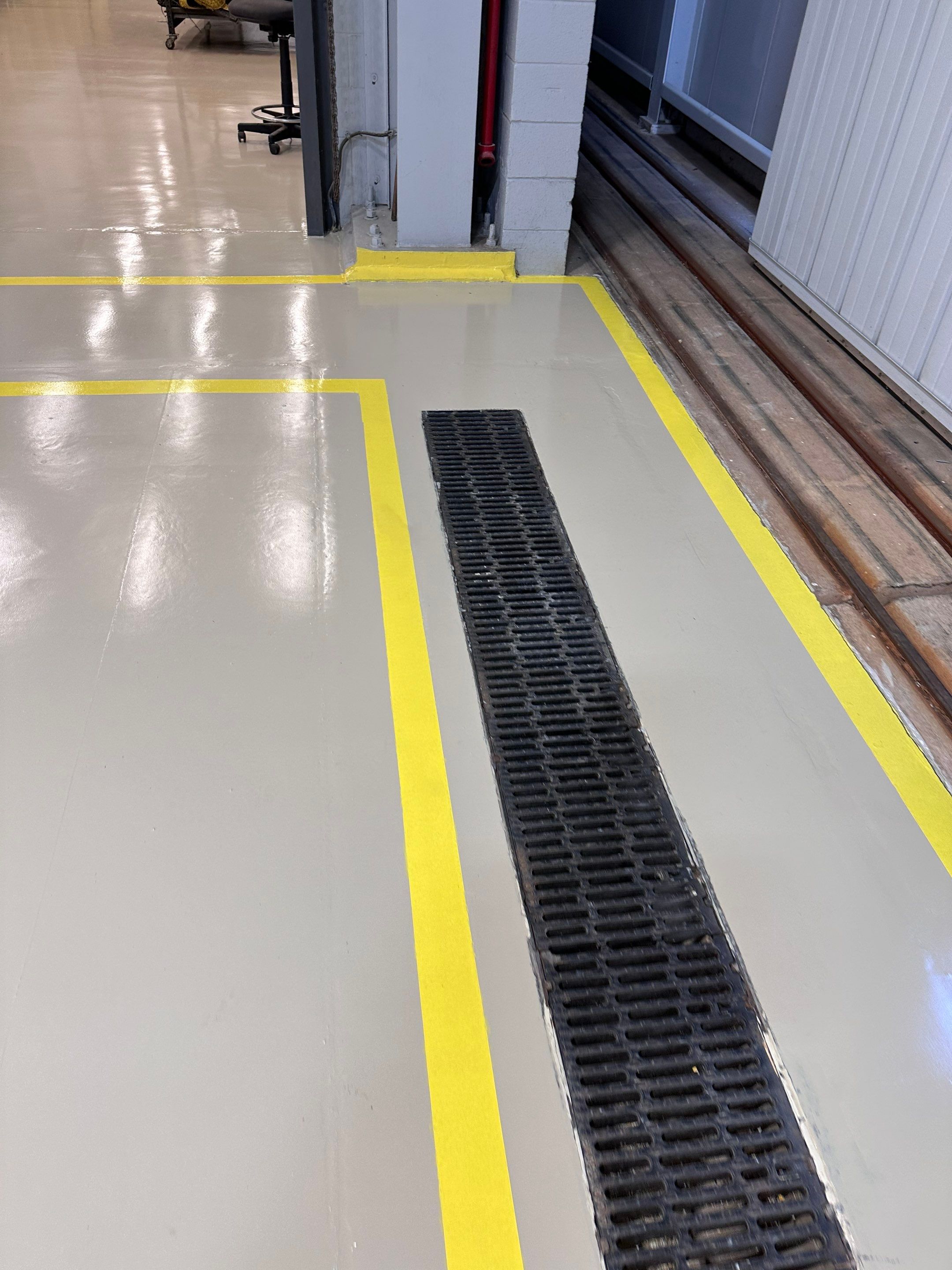 Industrial Epoxy Flooring for Army National Guard Hangar in Mobile by Cornerstone Hard Surface Restoration 