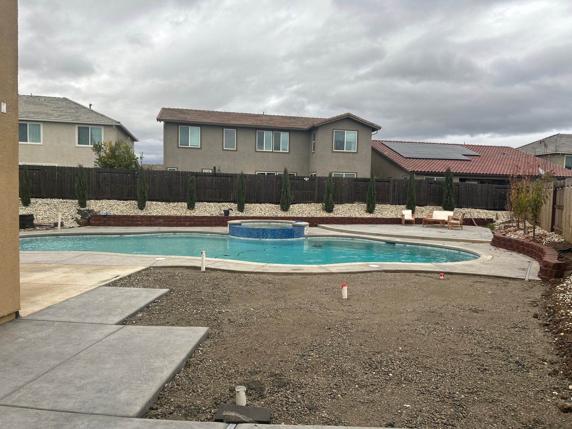 New Pool and Spa with Iridescent Blue Tile in Roseville by Dolphin Pools and Spas