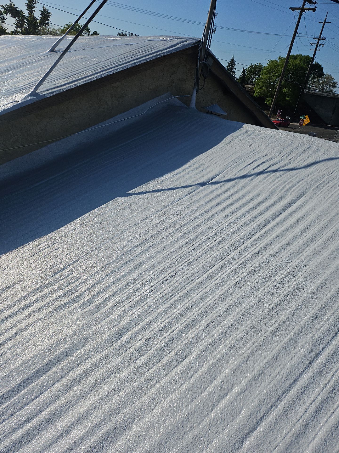 Spray foam and coatings using Conklin Benchmark/PUMA XL by Straight Edge Roofing Inc