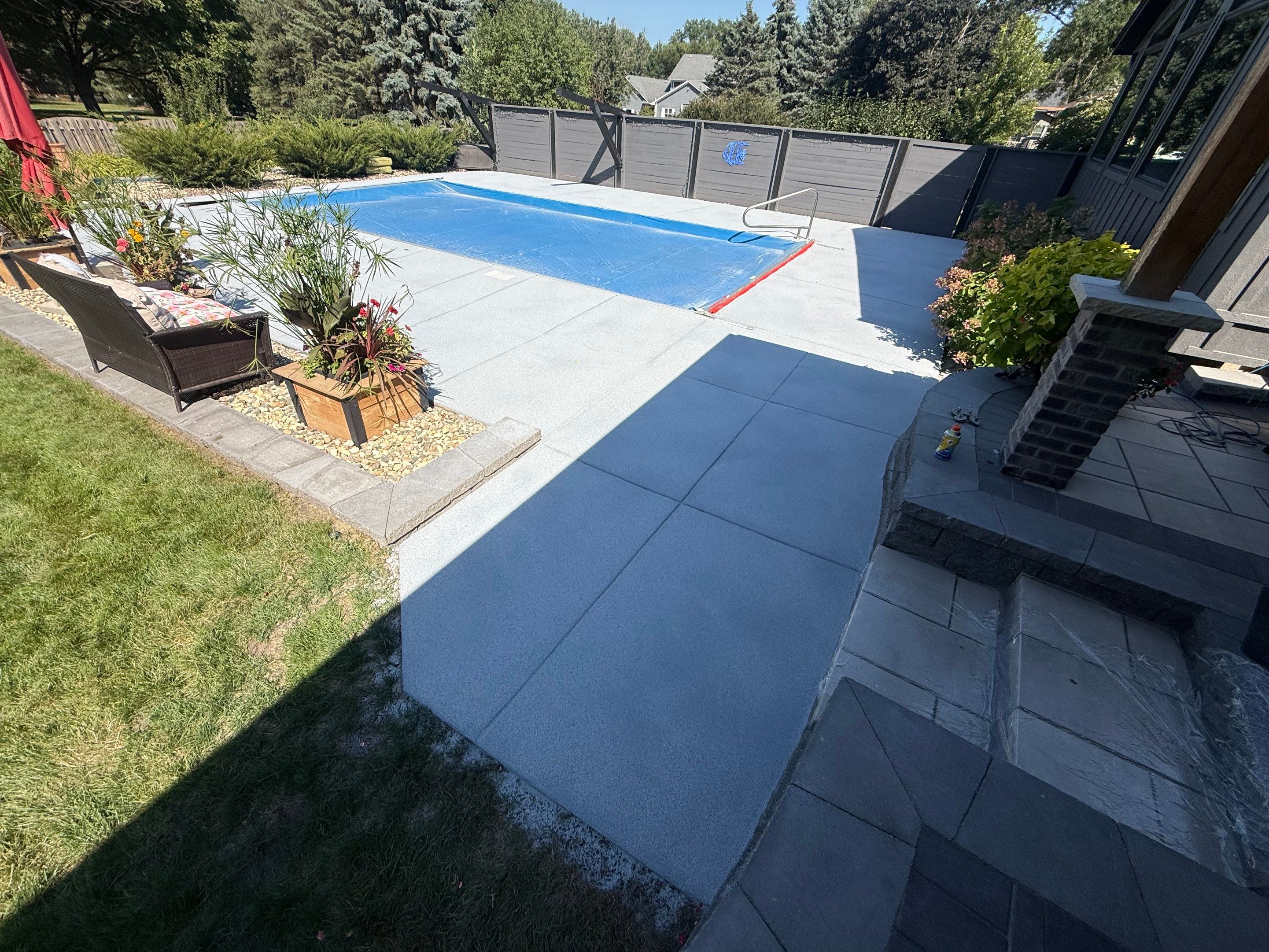 Garage Floor and Textured Pool Deck Coating in Sioux Falls by Select Painting, Coatings & Garage Cabinets